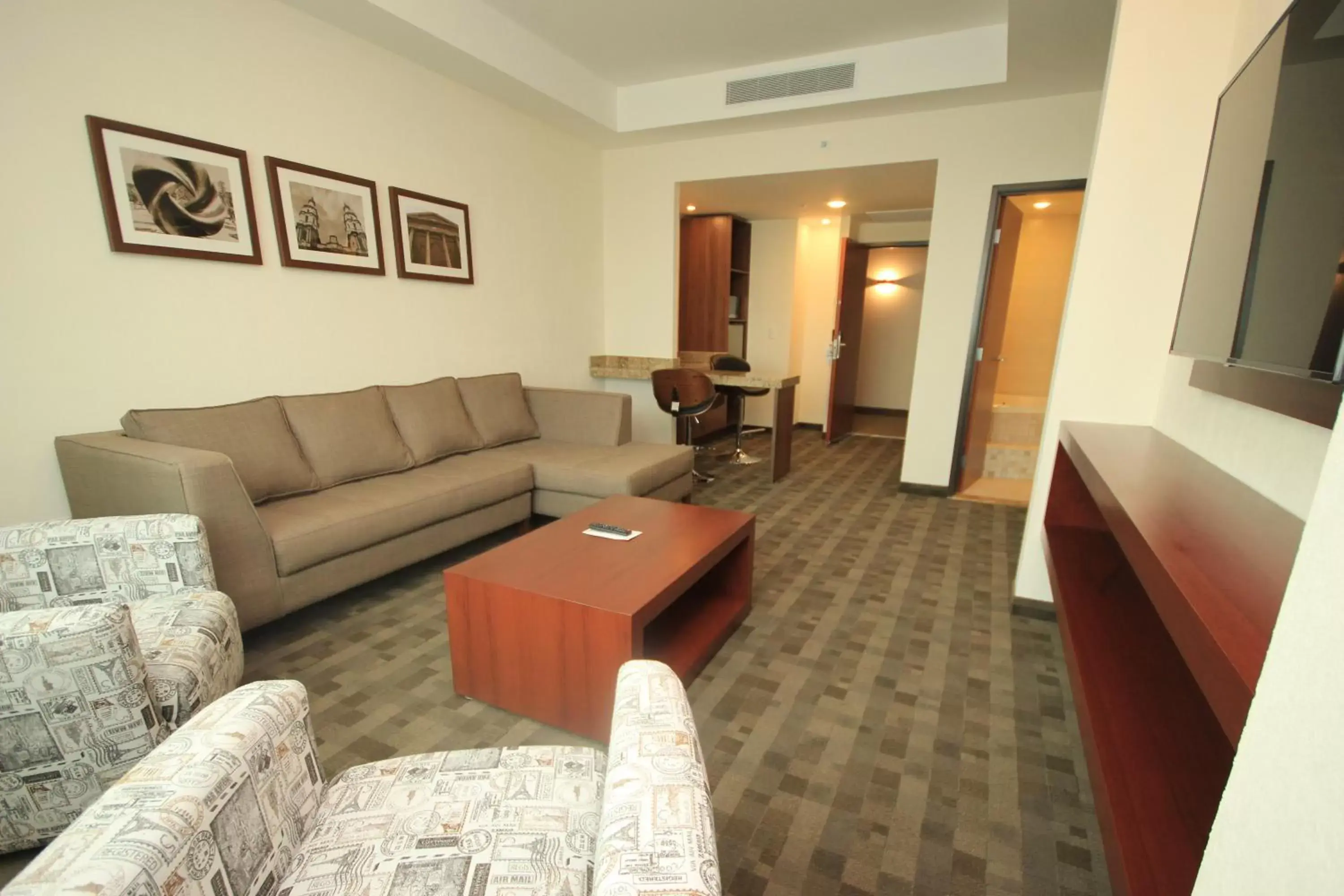 Photo of the whole room, Seating Area in Holiday Inn & Suites Plaza Mayor, an IHG Hotel