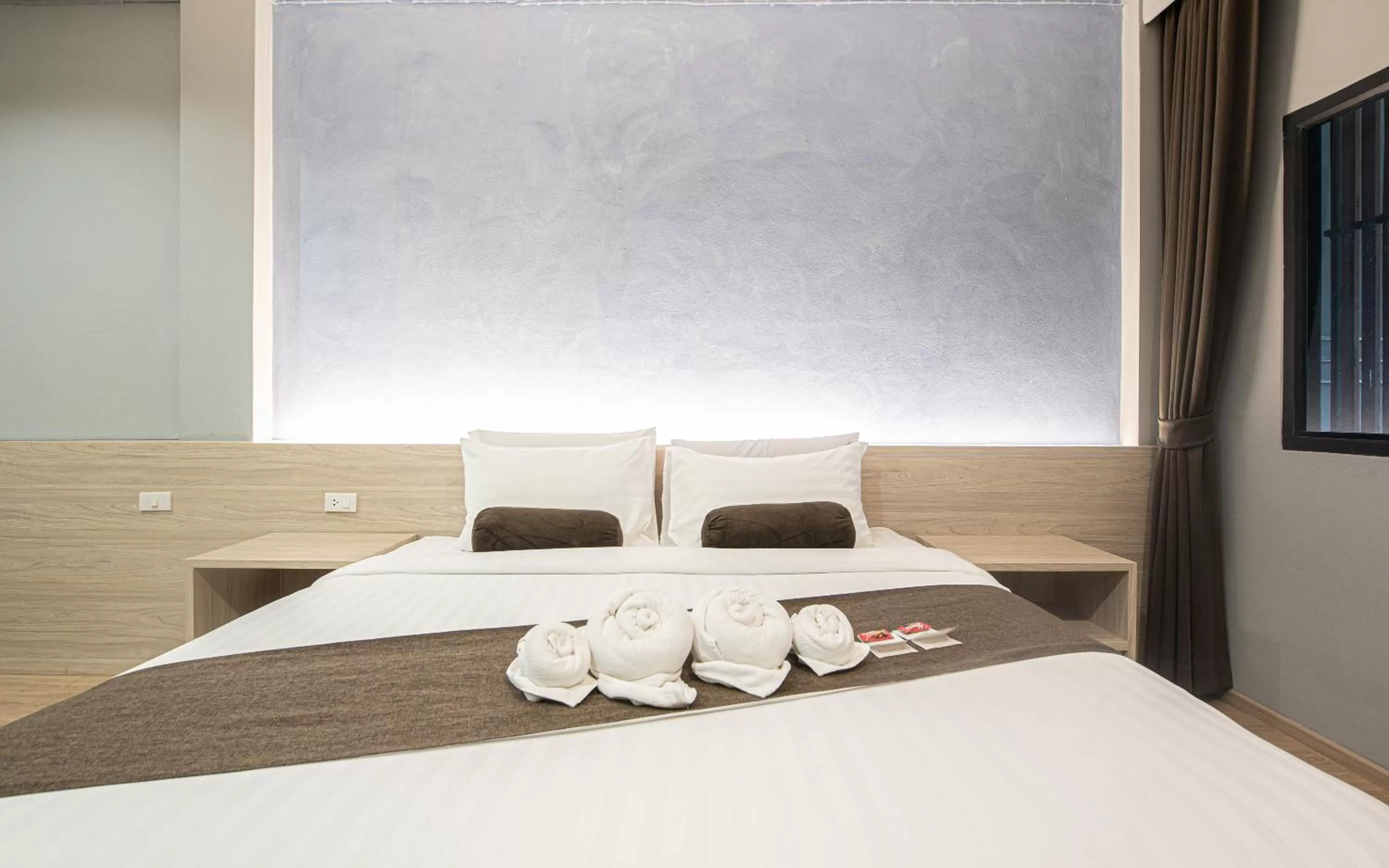 Bed in Tarnsiri Boutique Resort