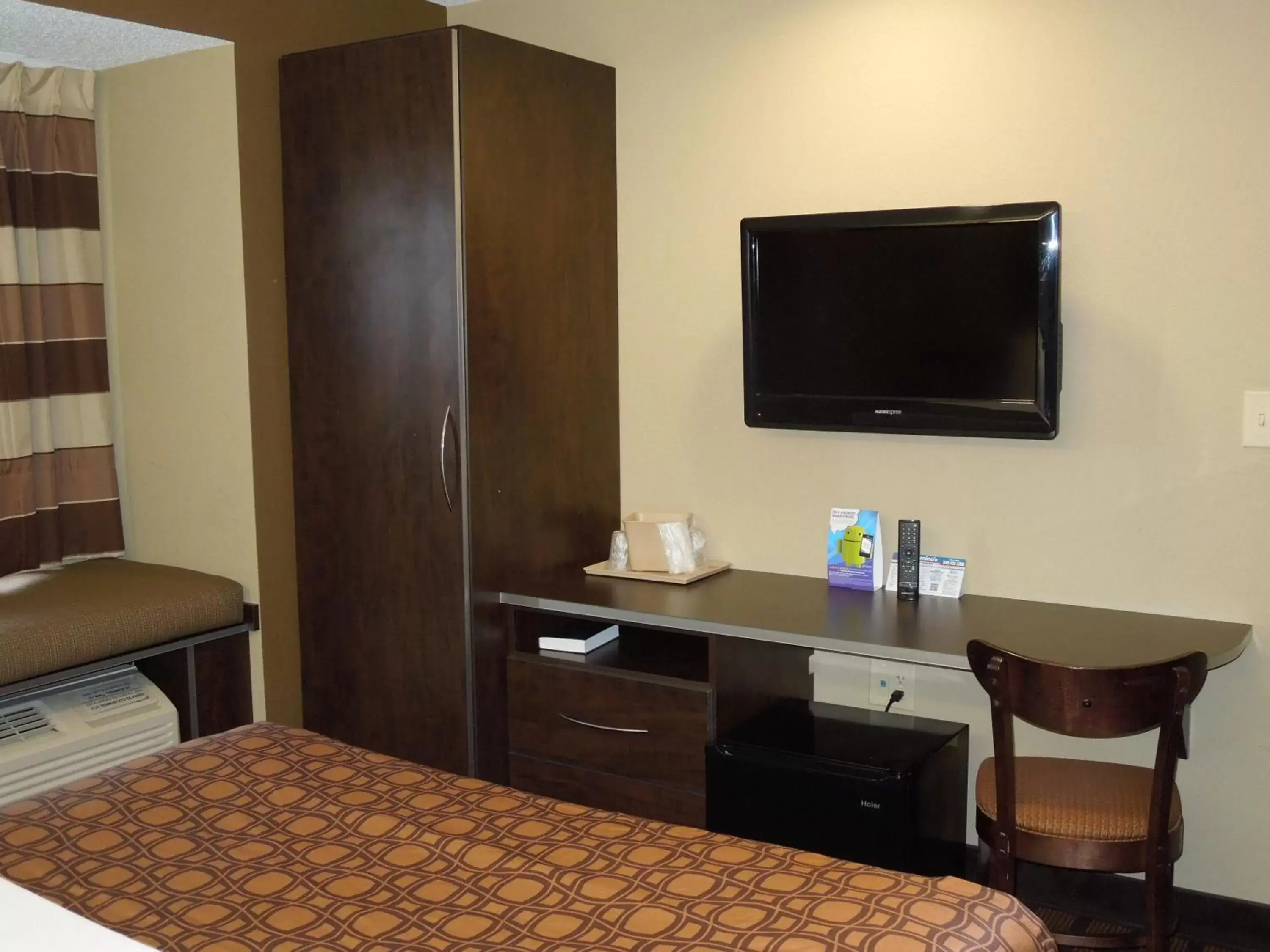 Photo of the whole room, TV/Entertainment Center in Microtel Inn & Suites by Wyndham Harrisonburg