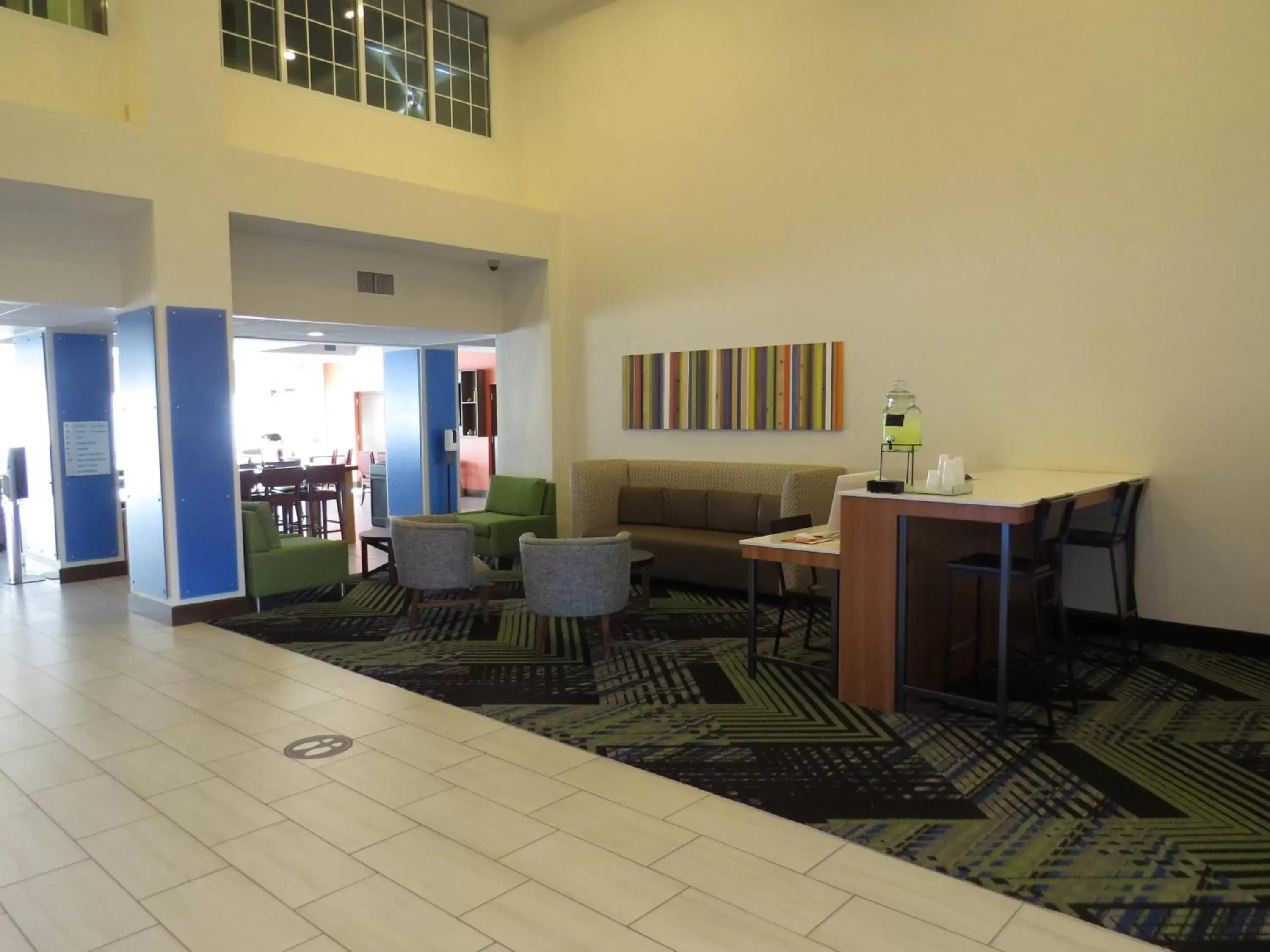 Property building, Seating Area in Holiday Inn Express - Spring Hill FLORIDA, an IHG Hotel