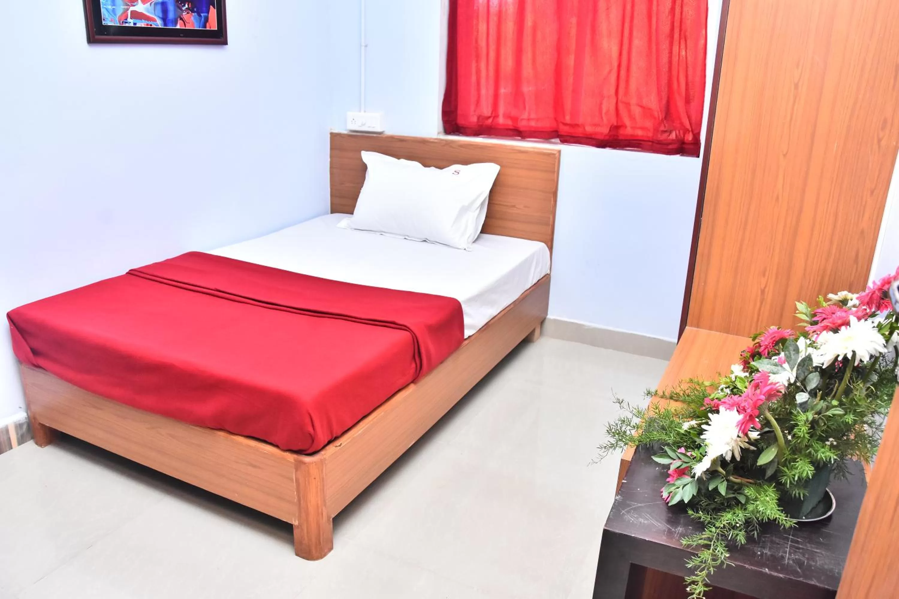 Bed in Sangam Inn & Banquets