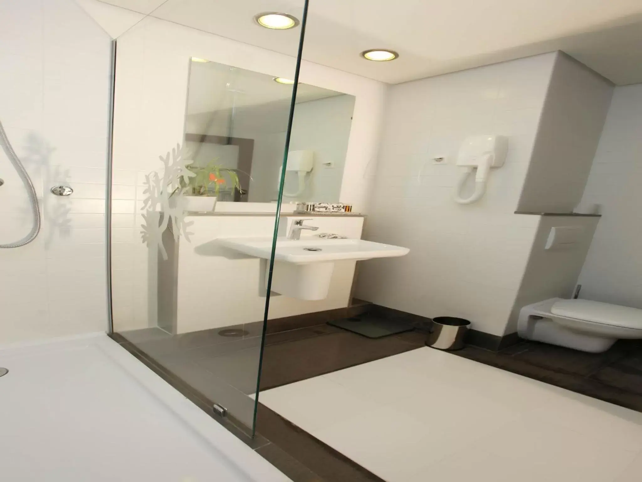 Bathroom in Le Corail Suites Hotel