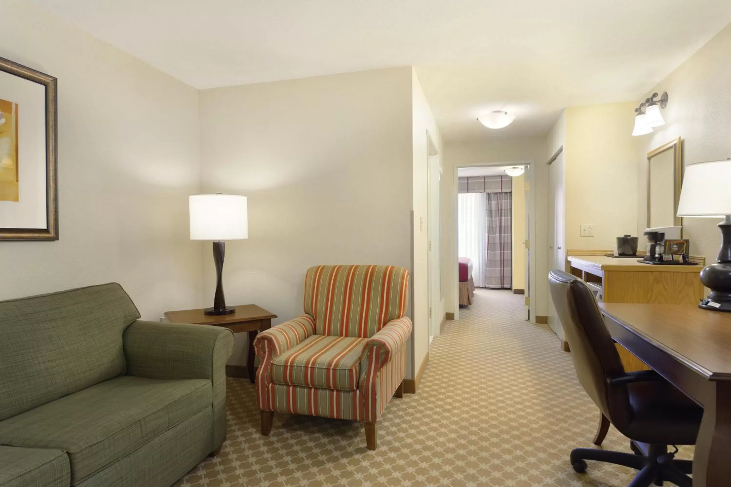 Seating Area in Country Inn & Suites by Radisson, Nevada, MO