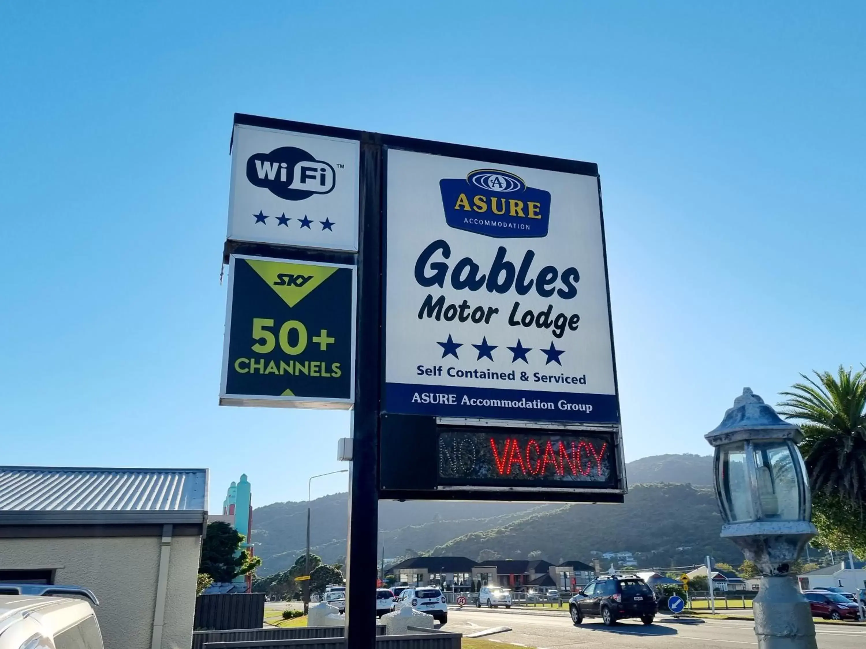 Property logo or sign in ASURE Gables Motor Lodge