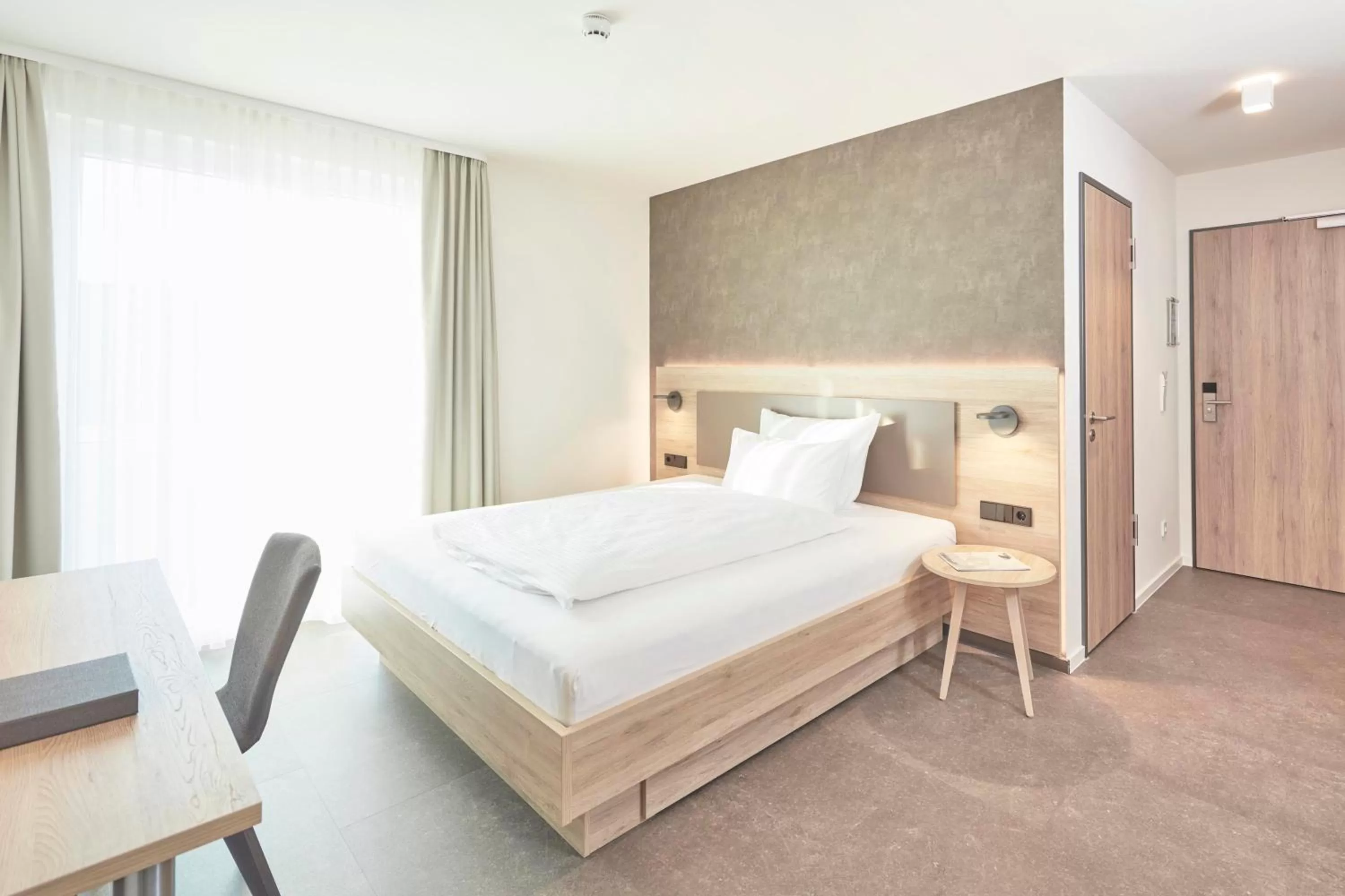 Bed in Gästehaus Bauer - Schlafen auf dem Weingut