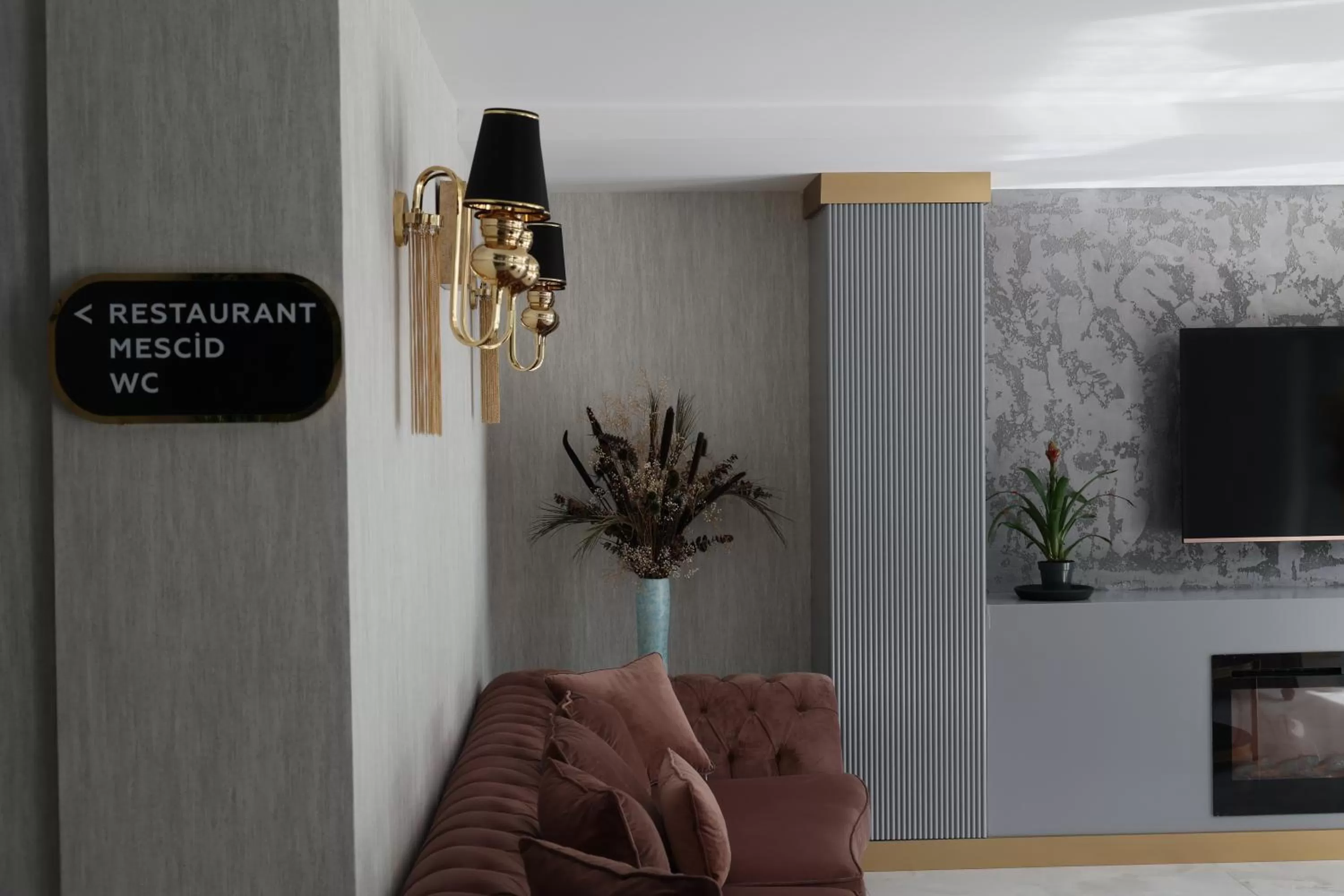 Communal lounge/ TV room in Avion Suite Hotel