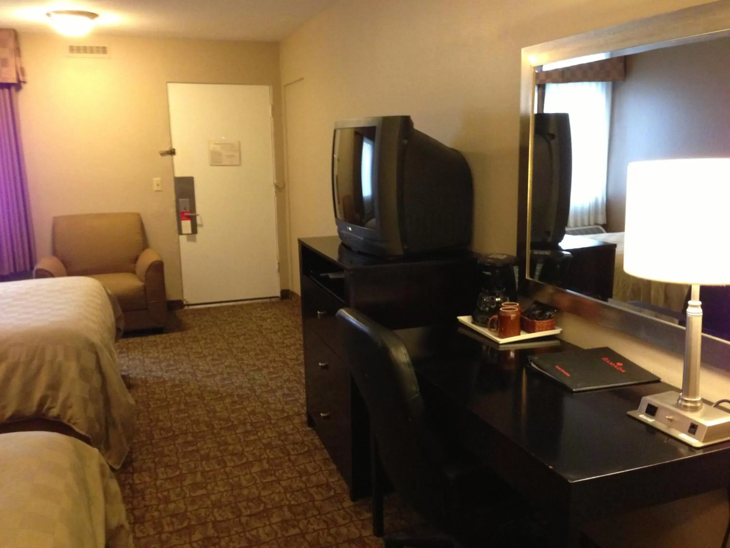 Photo of the whole room, TV/Entertainment Center in Ramada by Wyndham Fresno North