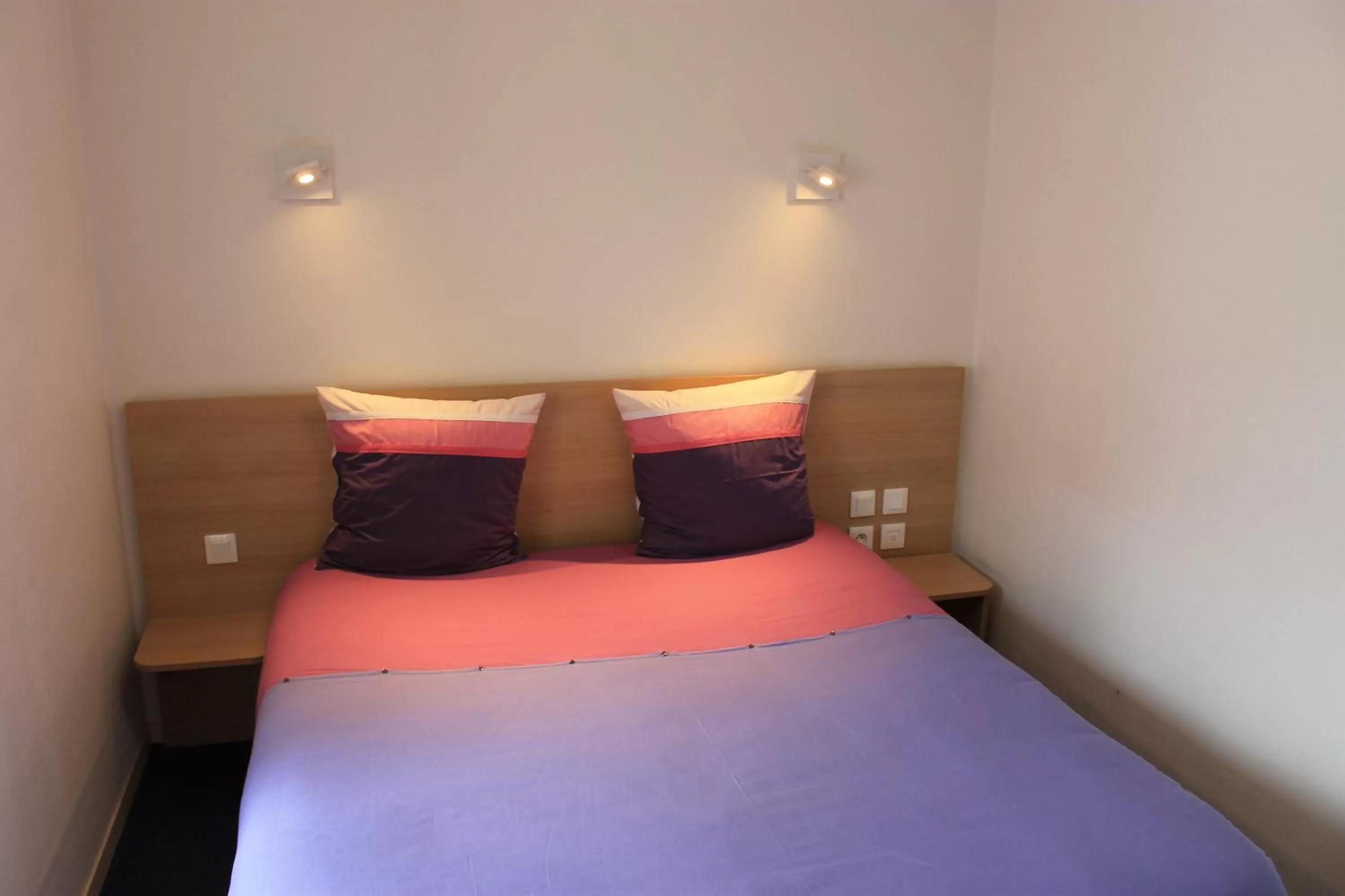 Bed in Hôtel du lion d'or