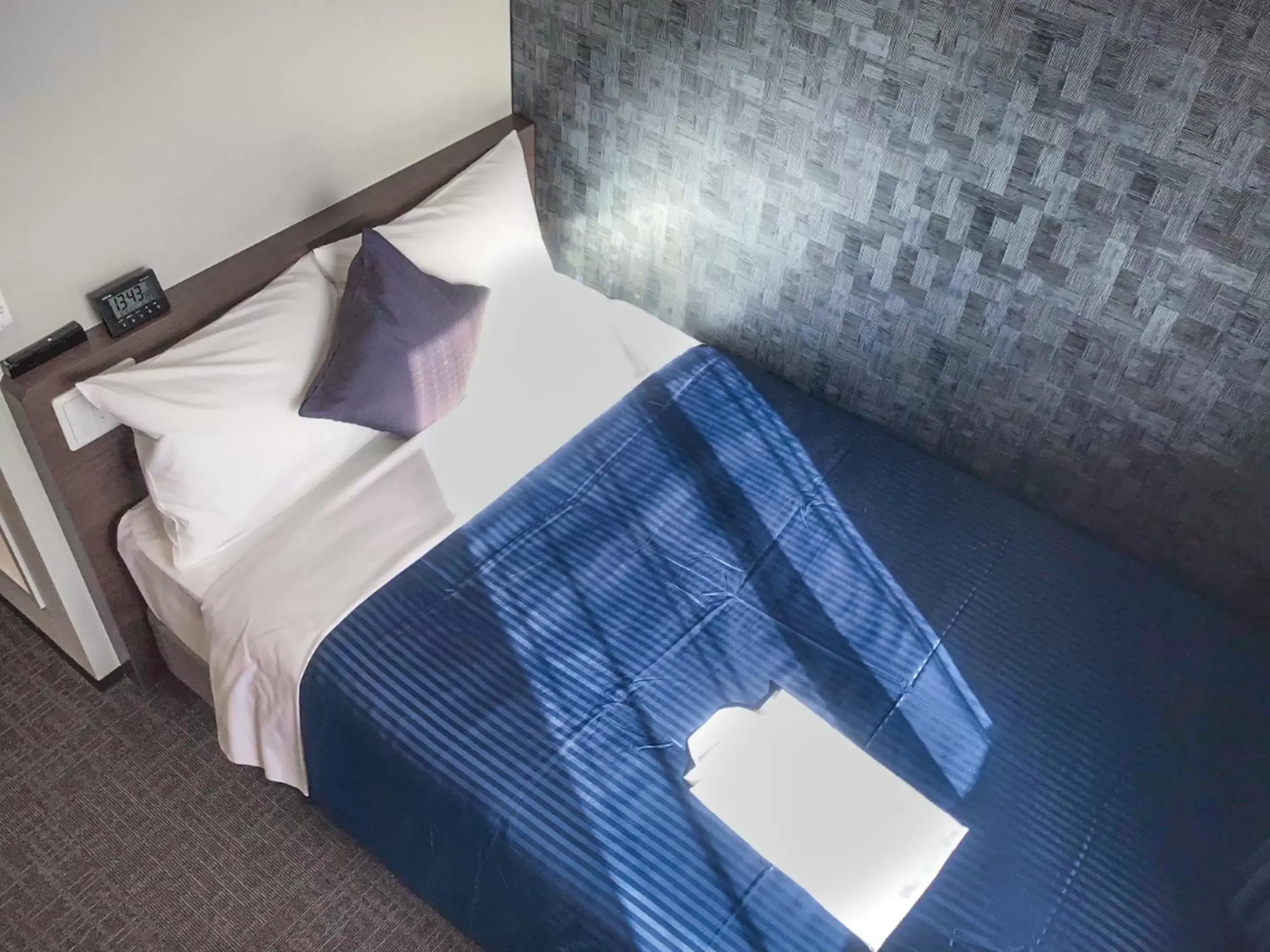 Bed in HOTEL LiVEMAX Okayama