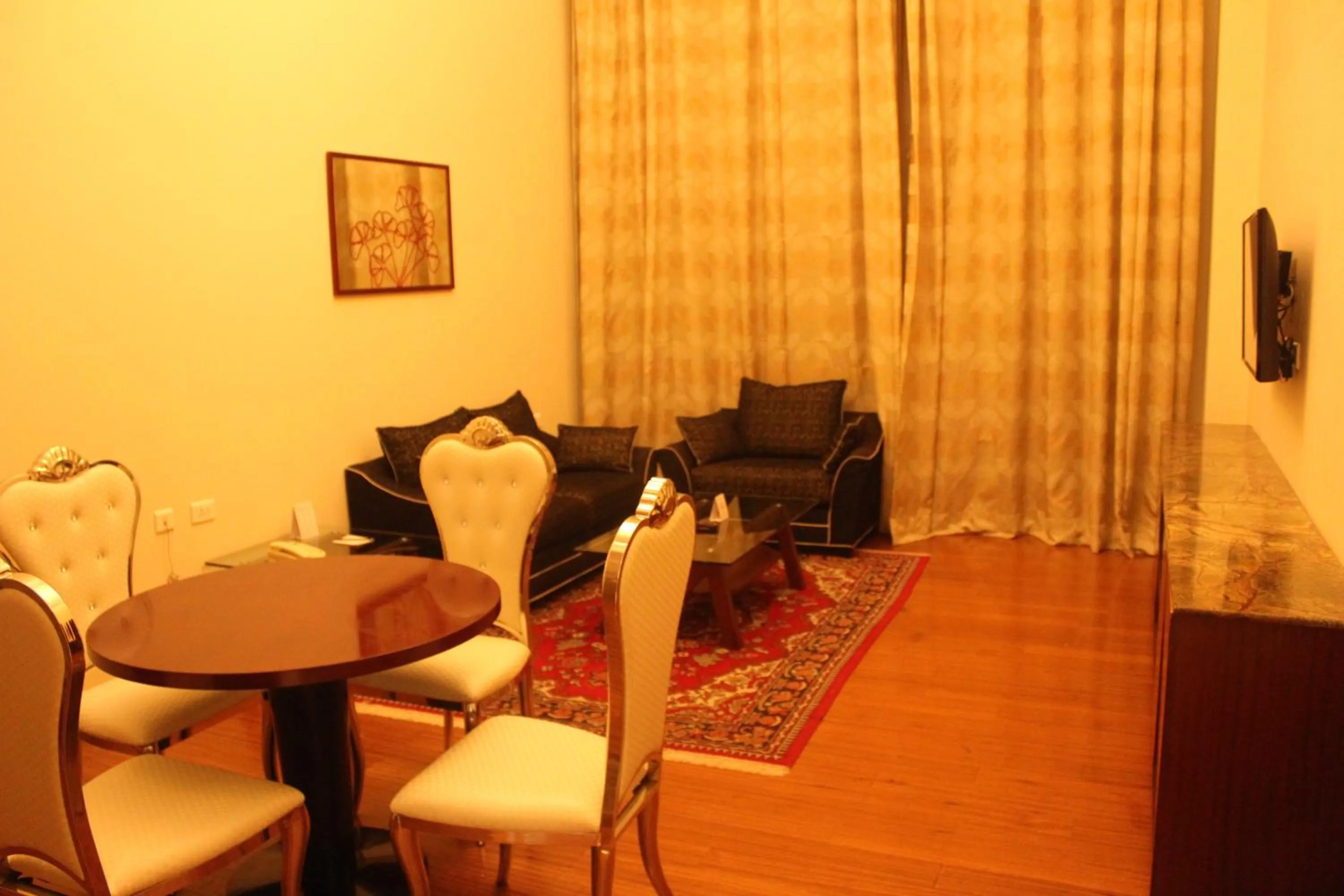 Living room in Ramada by Wyndham Jaipur Jaisinghpura