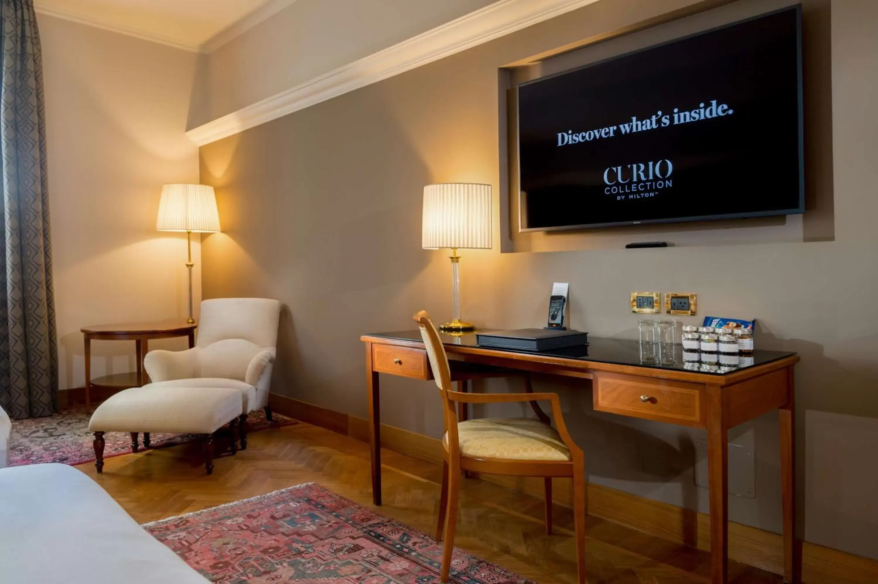 Living room, TV/Entertainment Center in Grand Hotel Villa Torretta, Curio Collection by Hilton