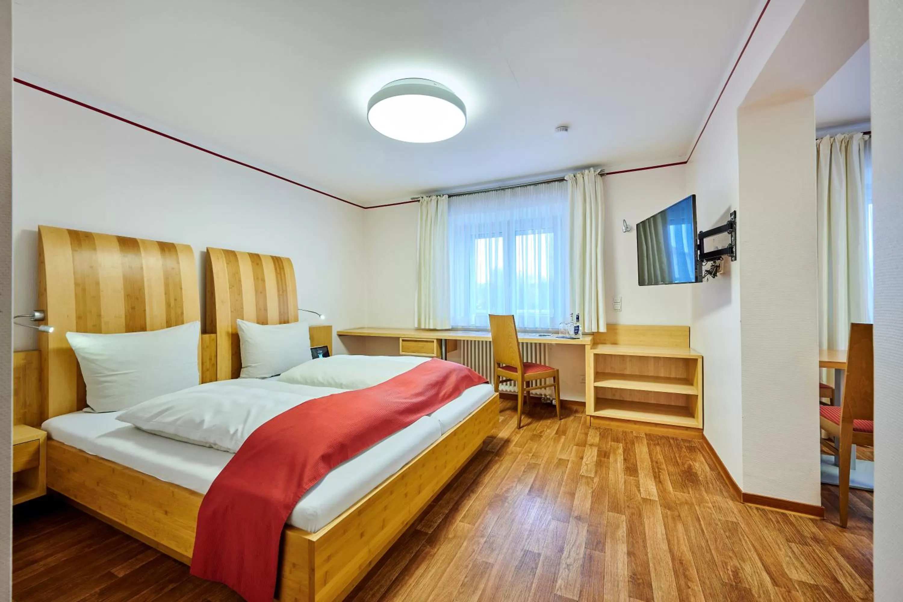 Photo of the whole room, Bed in Genusshotel Wenisch