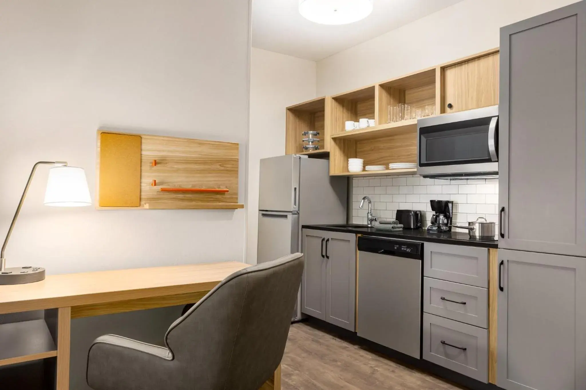 Photo of the whole room, Kitchen/Kitchenette in Candlewood Suites McPherson, an IHG Hotel