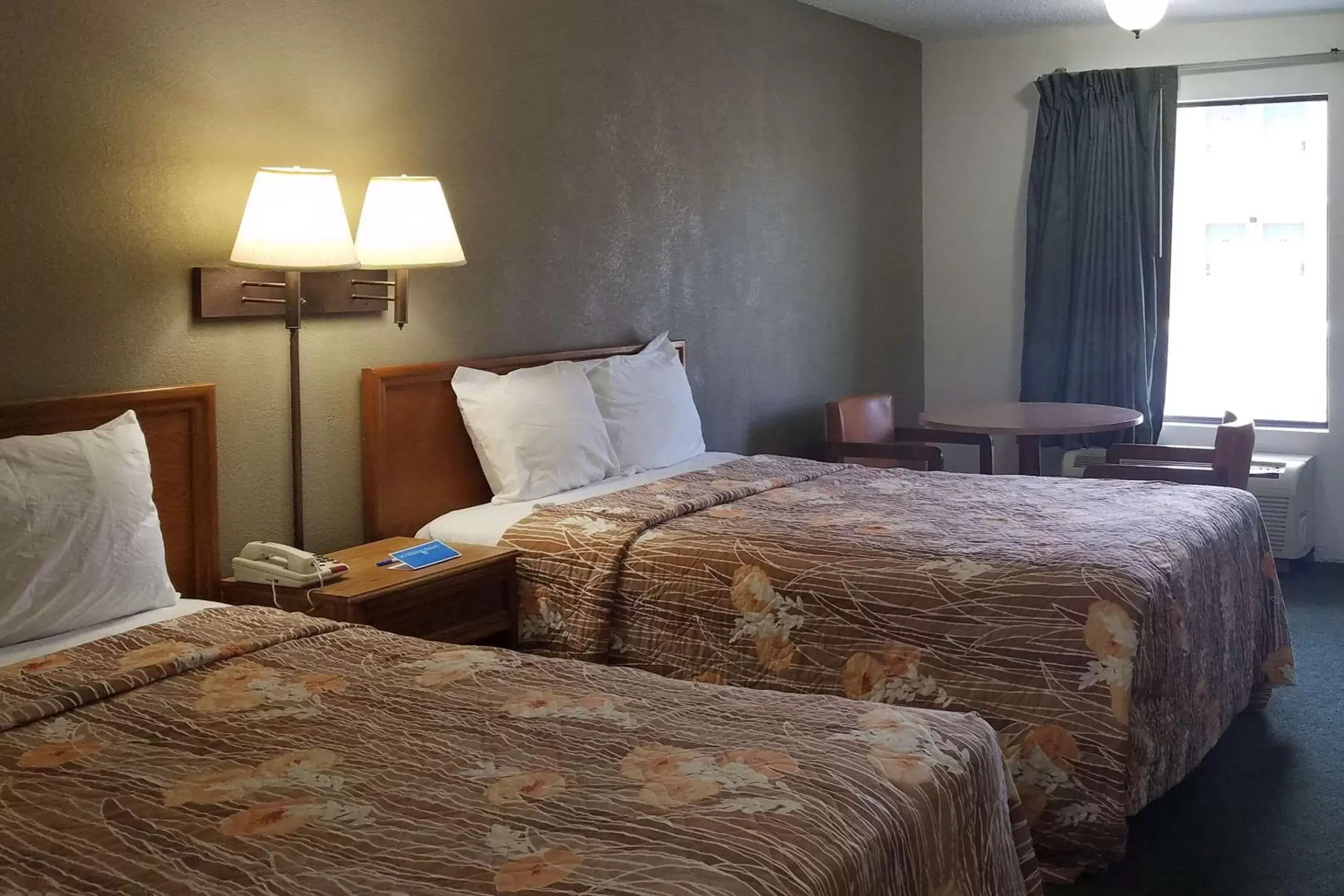 Bed in Travelers Inn & Suites