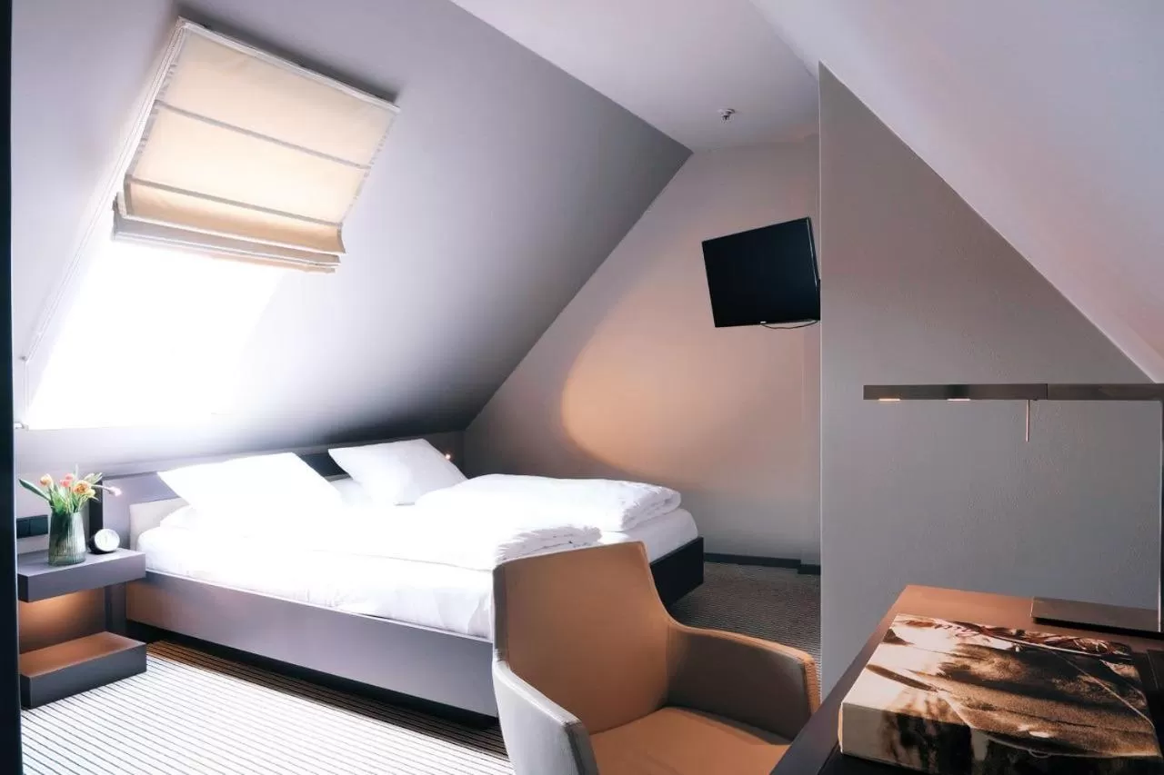 Bed in Zum Löwen Design Hotel Resort & Spa