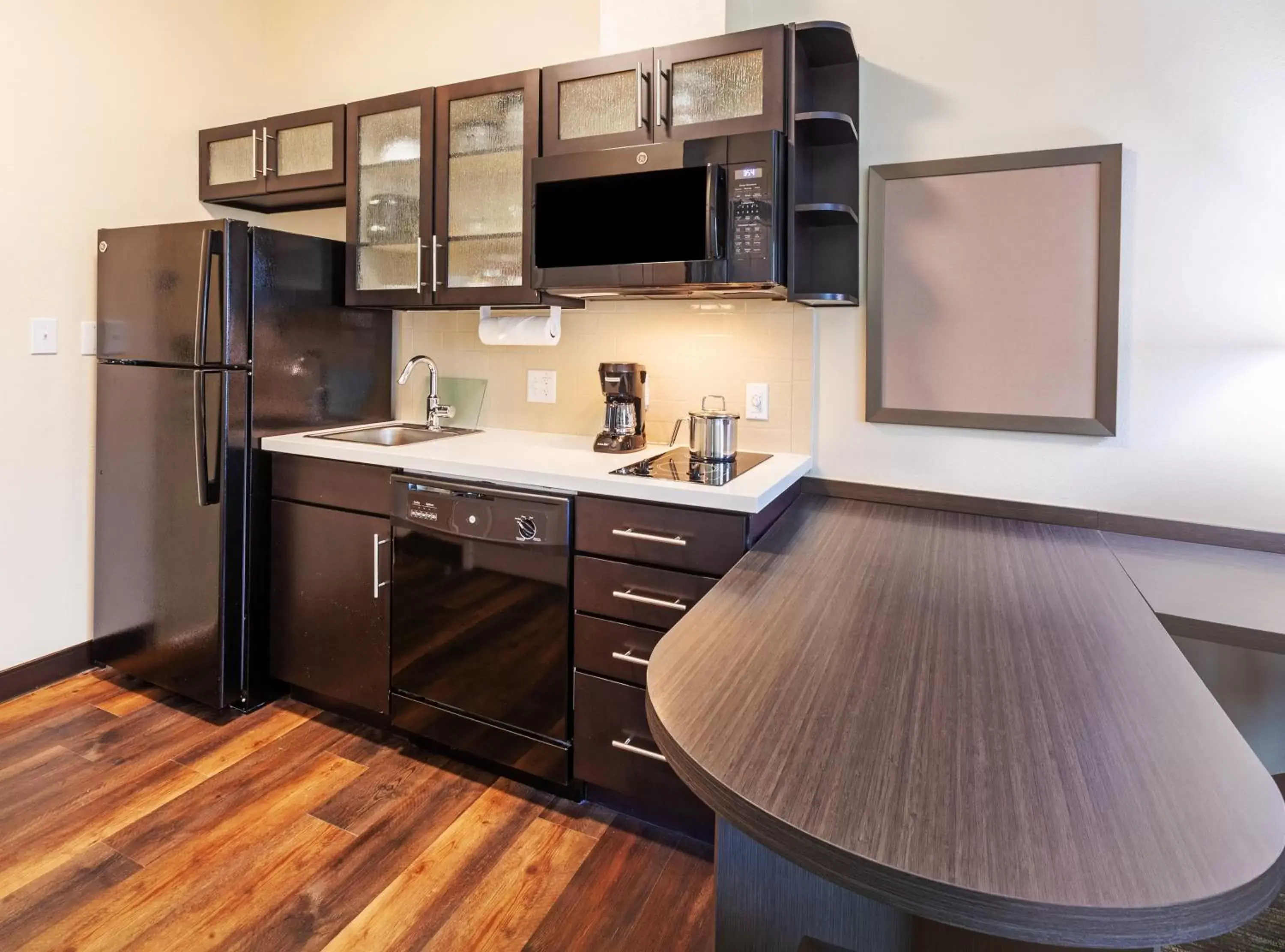 Photo of the whole room, TV/Entertainment Center in Candlewood Suites - Houston - Pasadena, an IHG Hotel