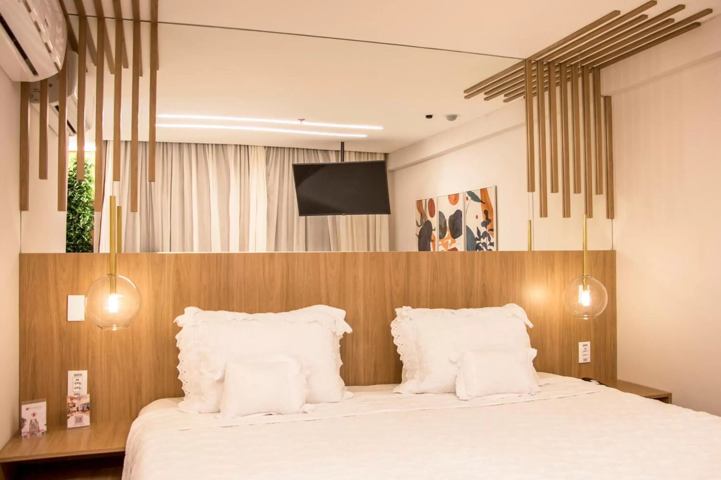 Bed in Ramada Hotel & Suites Campos Pelinca