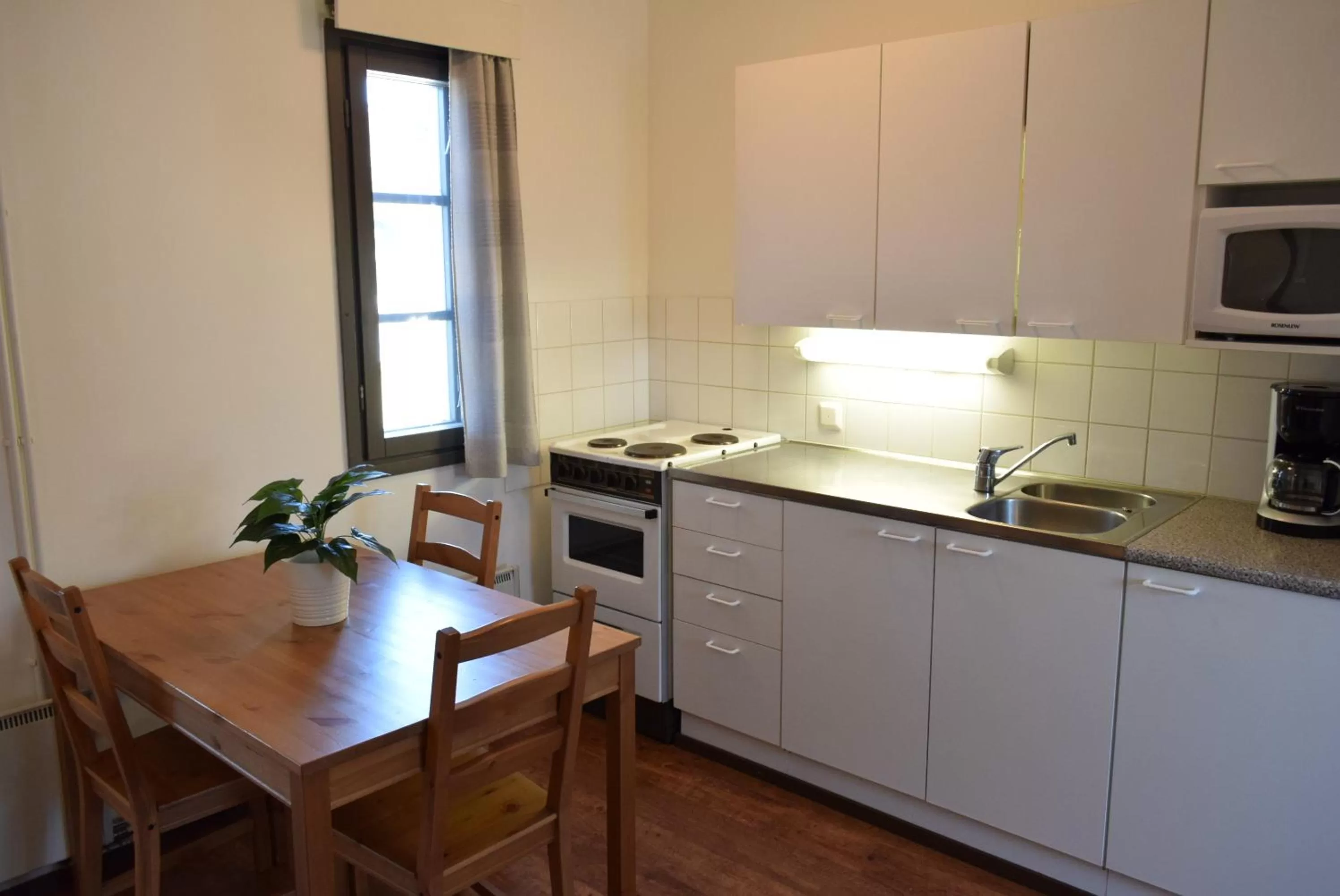 Kitchen or kitchenette in Visulahti Cottages