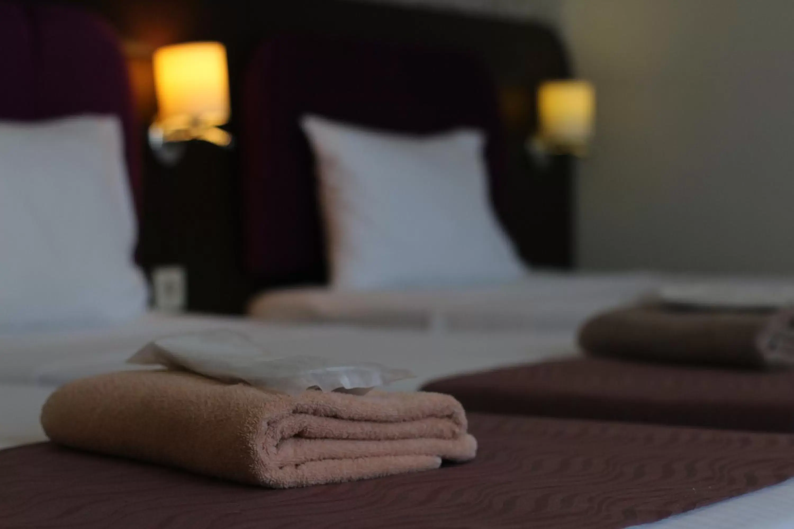 towels, Bed in Niconya Port Suite&Hotel