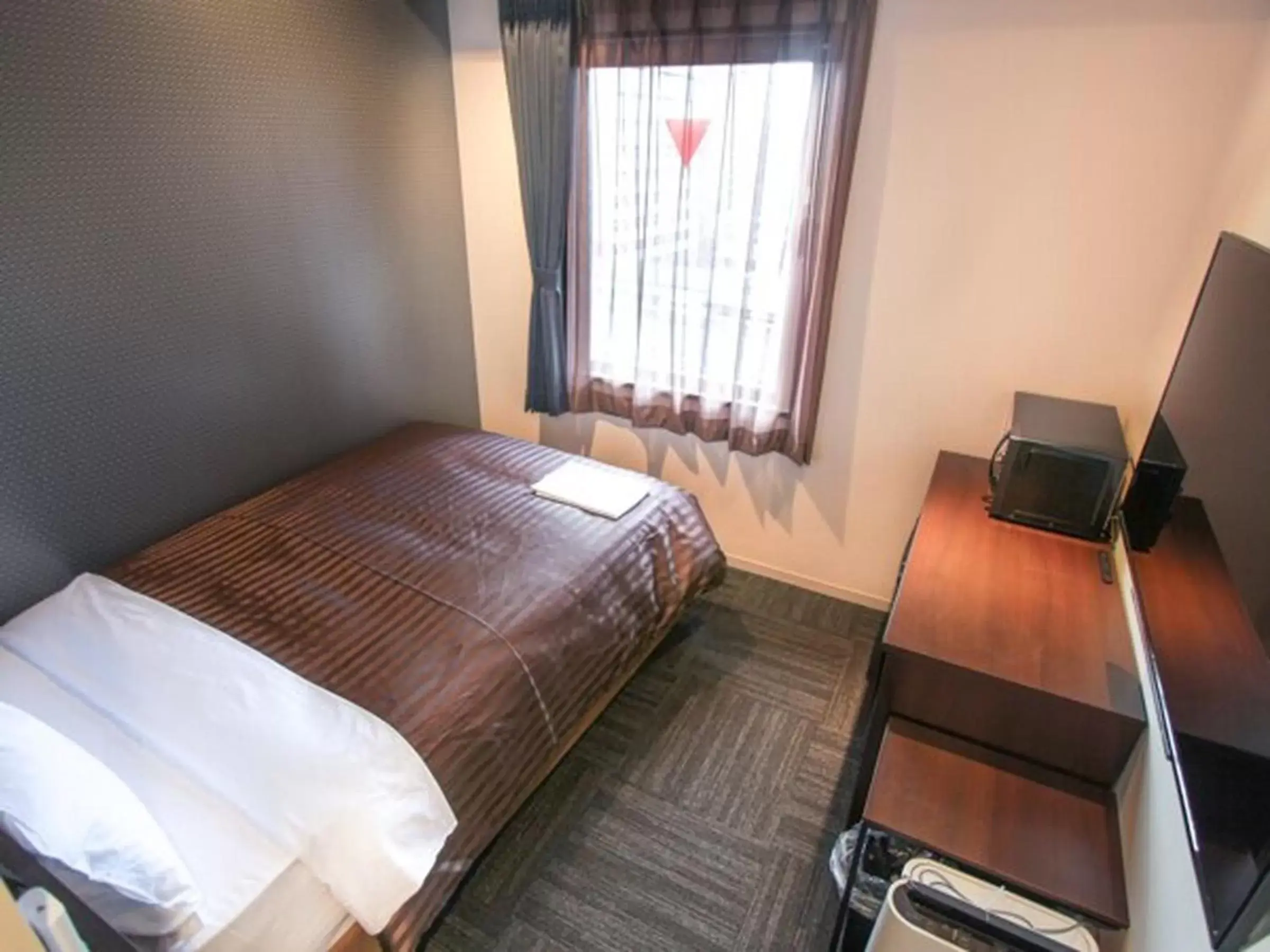 Bed in Hotel Livemax Osaka Kadoma
