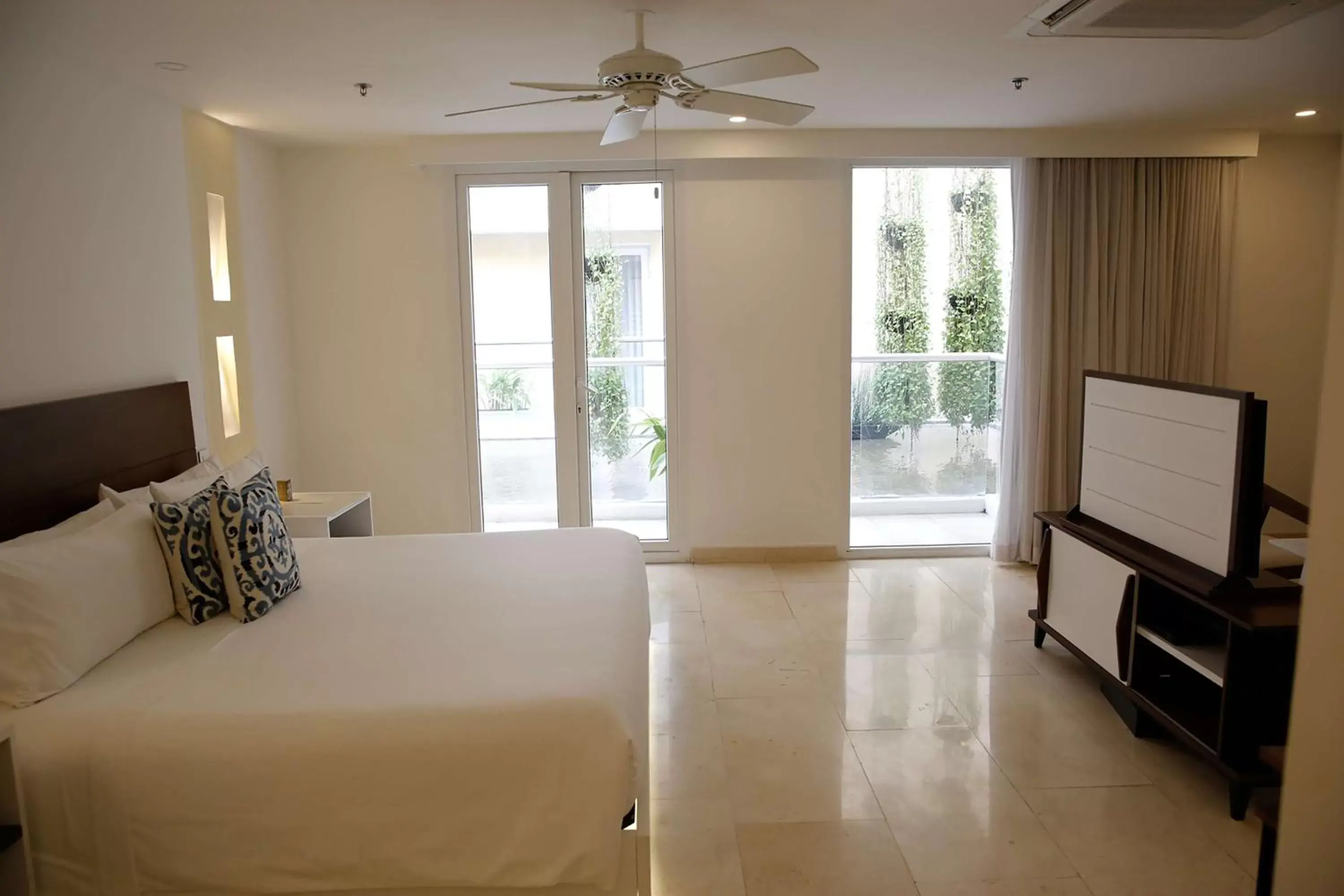 Bed in Nacar Hotel Cartagena, Curio Collection by Hilton