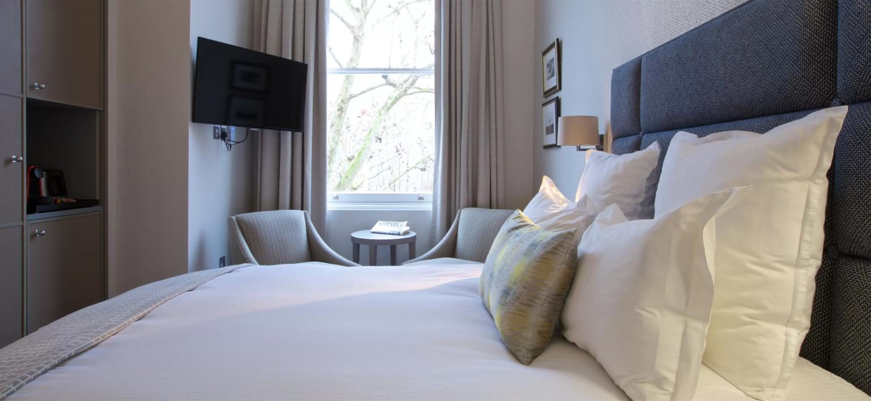 Bed in 54 Queen's Gate Hotel