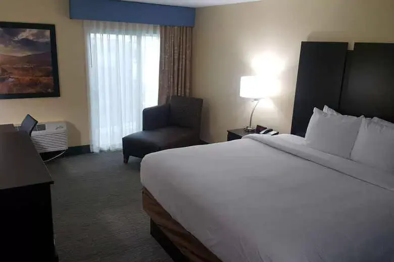 Bed in Days Inn & Suites by Wyndham Grand Rapids Near Downtown