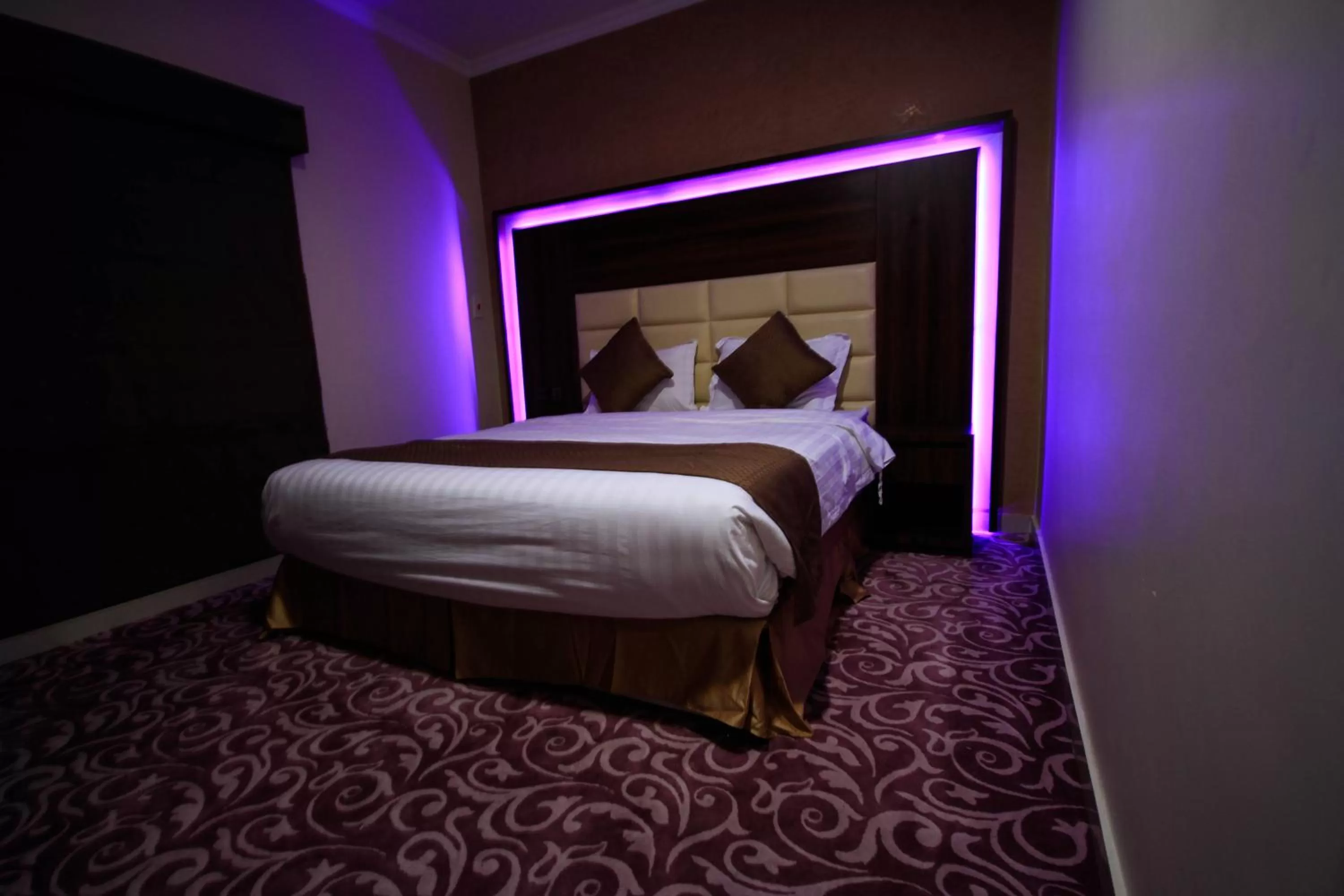 Bed in Maskan Al Dyafah Hotel Apartments