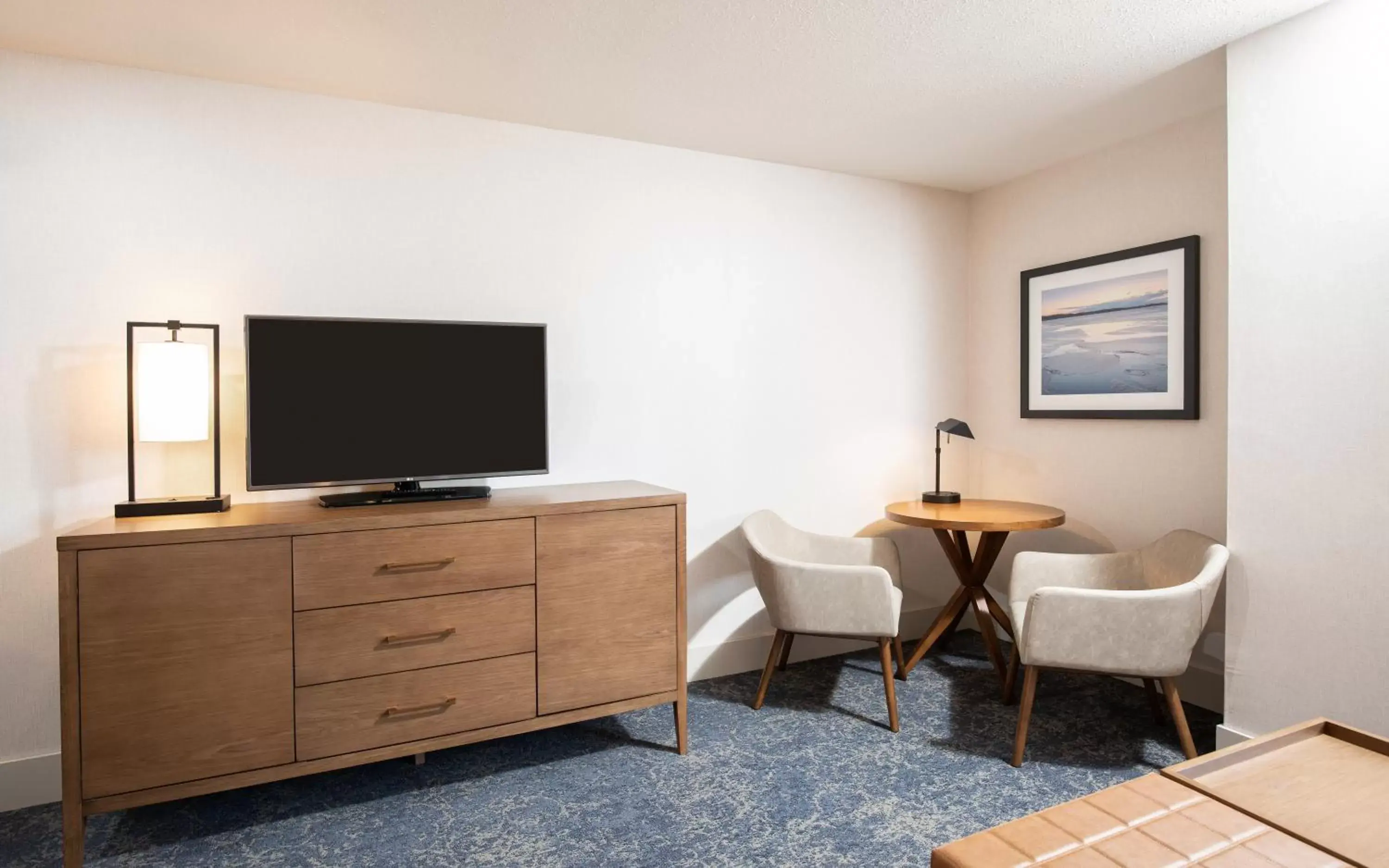 Seating area, TV/Entertainment Center in Pomeroy Hotel Fort McMurray