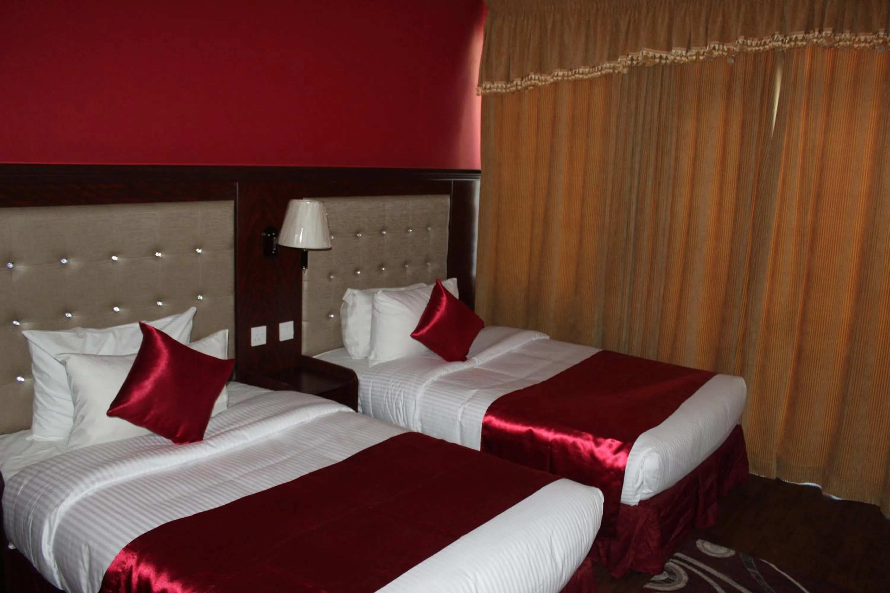 Bed in Grand Nova Hotel