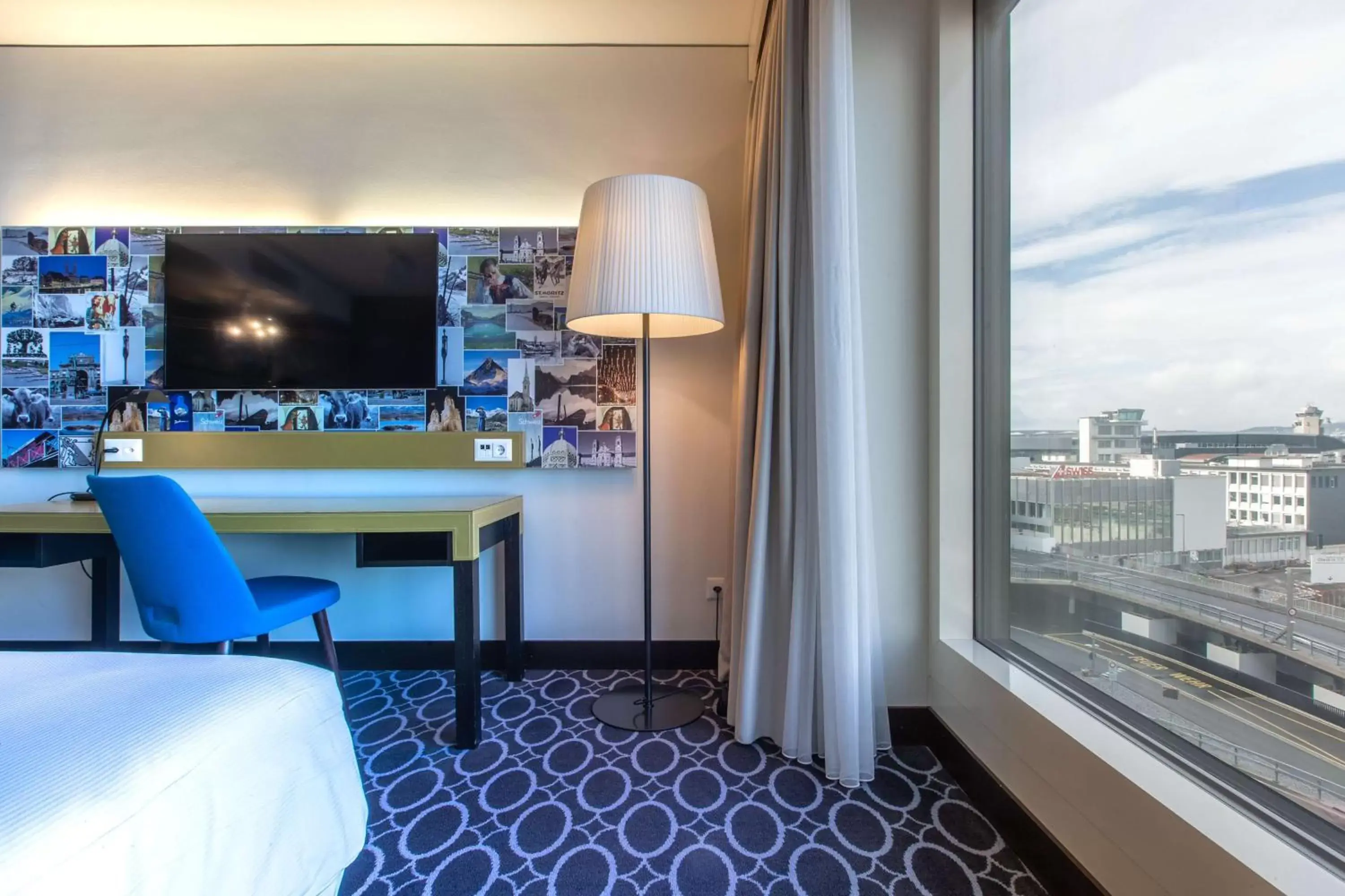 View (from property/room), TV/Entertainment Center in Radisson Blu Hotel Zurich Airport