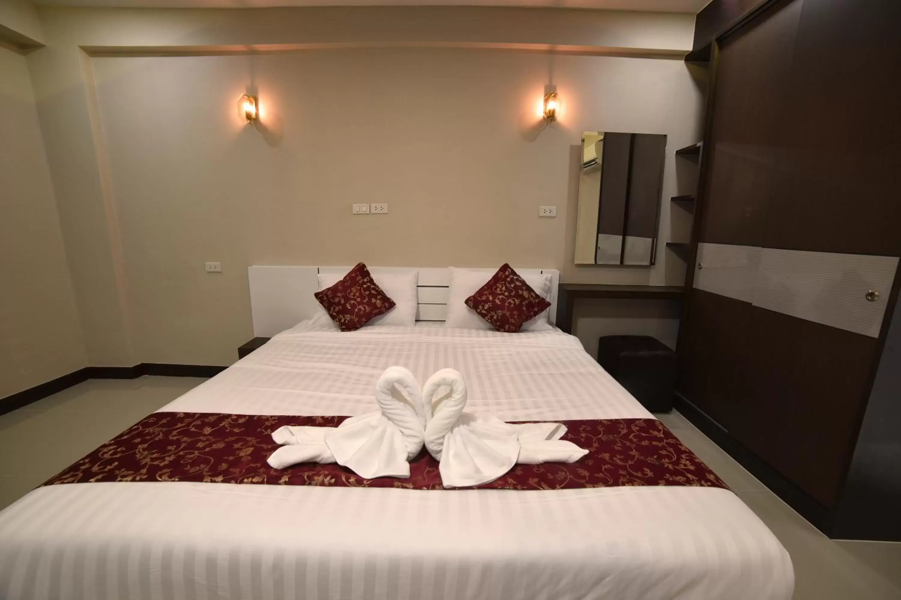 Bed in Gold Airport Suites