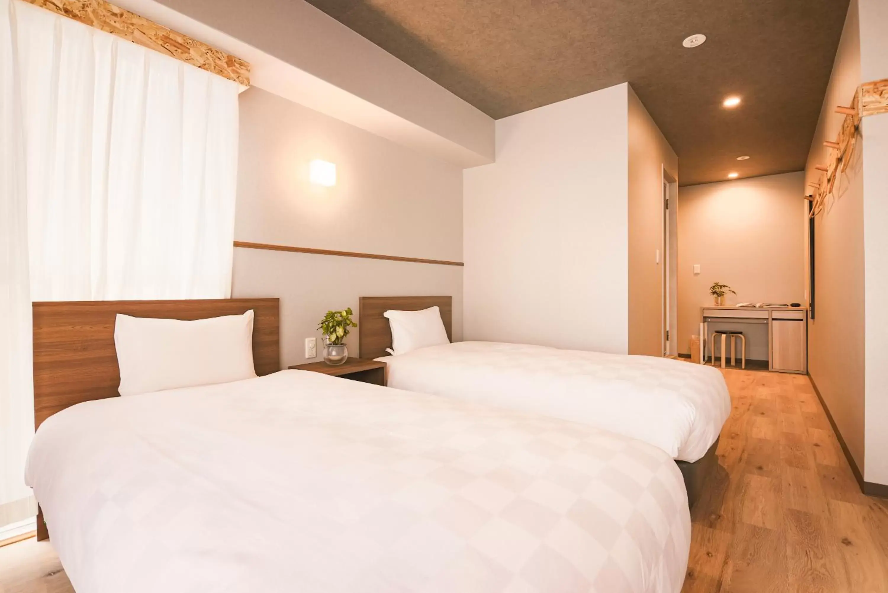 Bed in Wayfarer Kyoto Shijo