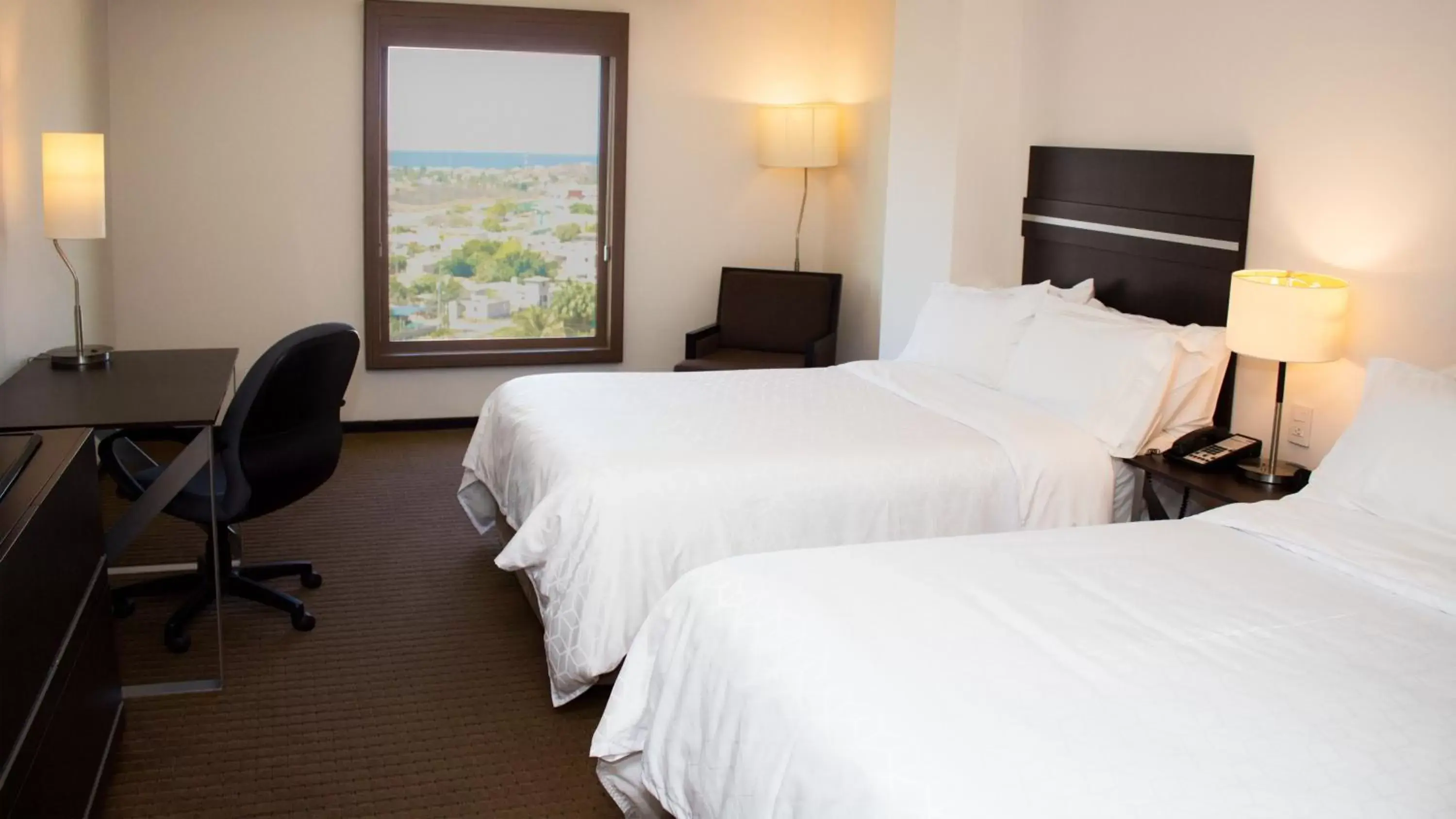 Bed in Holiday Inn Express Guaymas, an IHG Hotel
