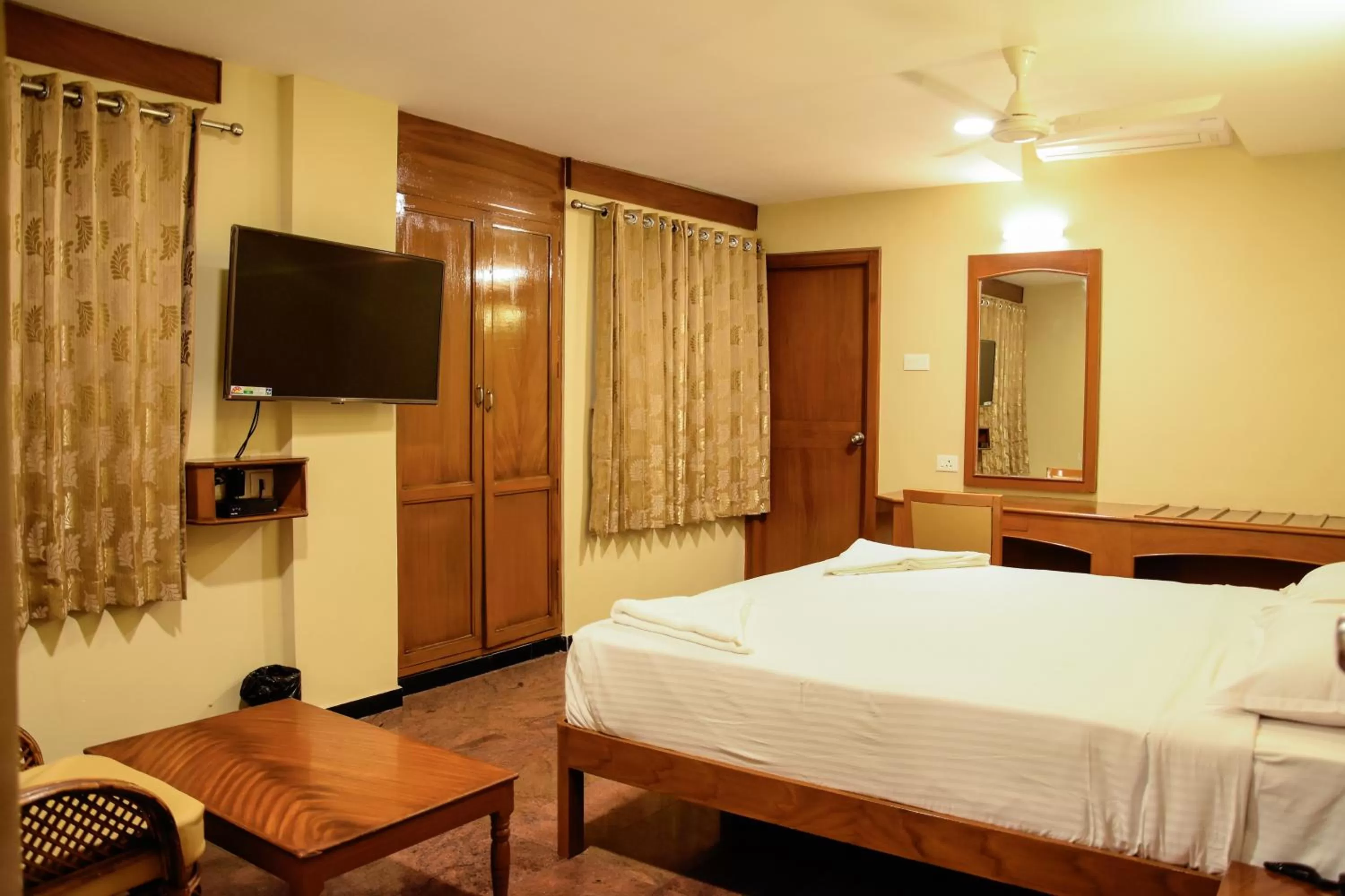 Photo of the whole room, Bed in Poppys Tower Tiruppur