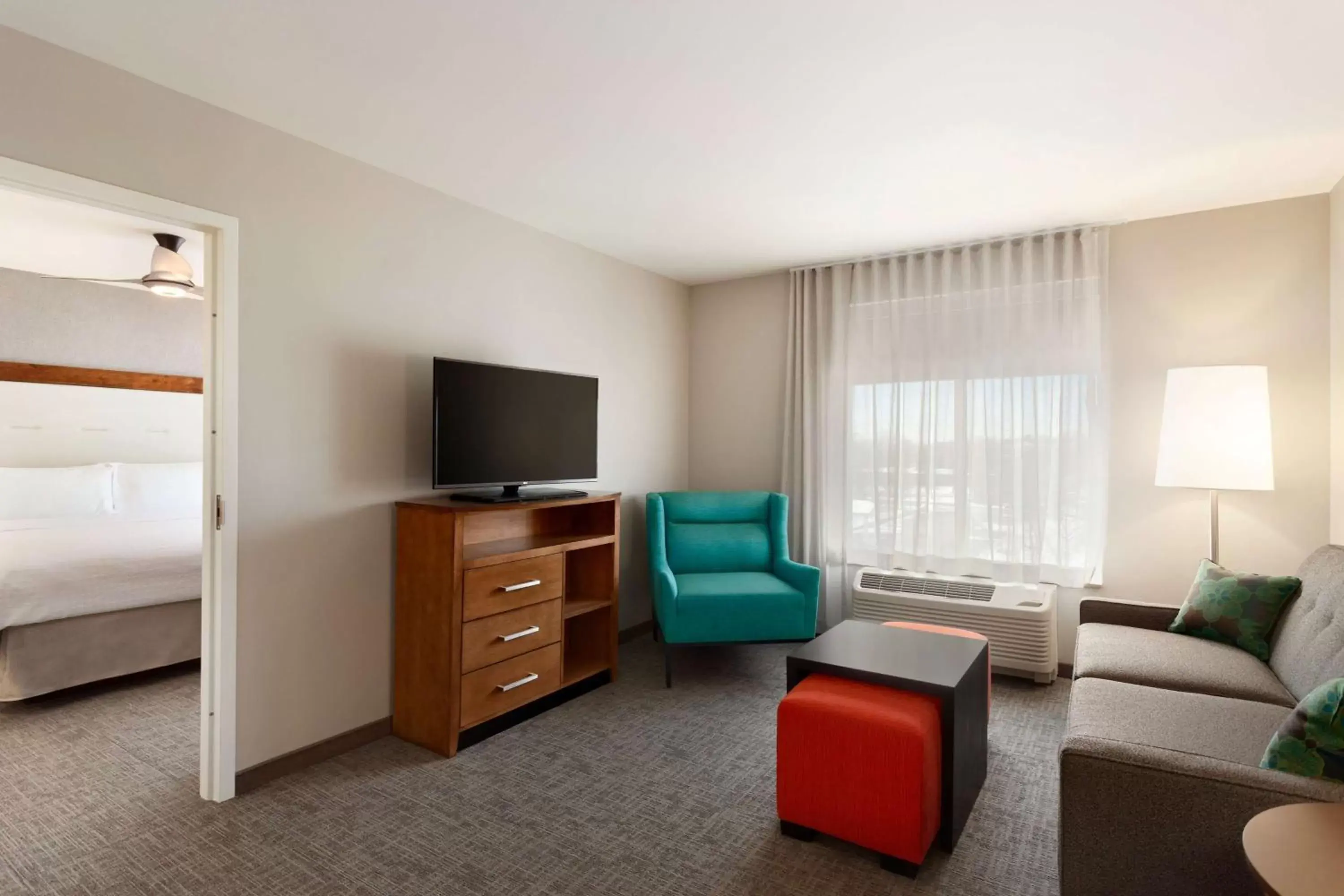 Living room, TV/Entertainment Center in Homewood Suites by Hilton Syracuse - Carrier Circle