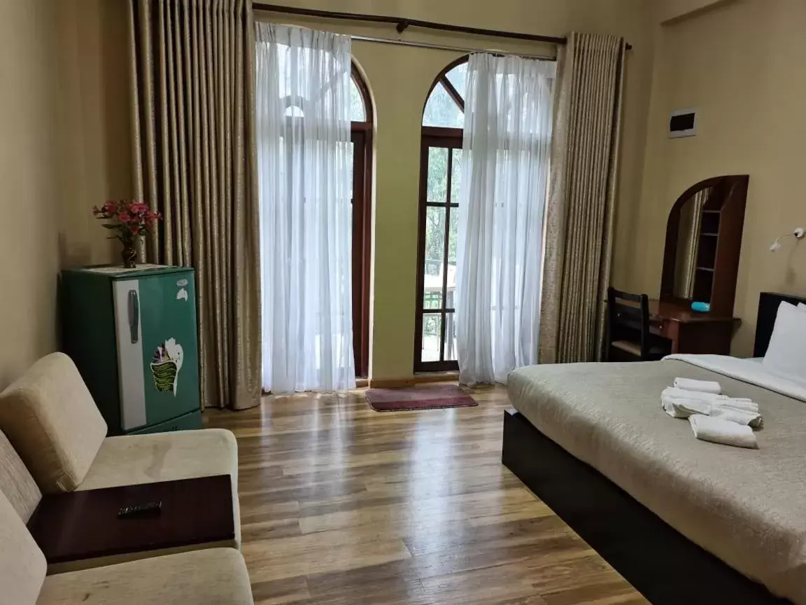 Photo of the whole room, TV/Entertainment Center in Panorama Green View Hotel Nuwara Eliya