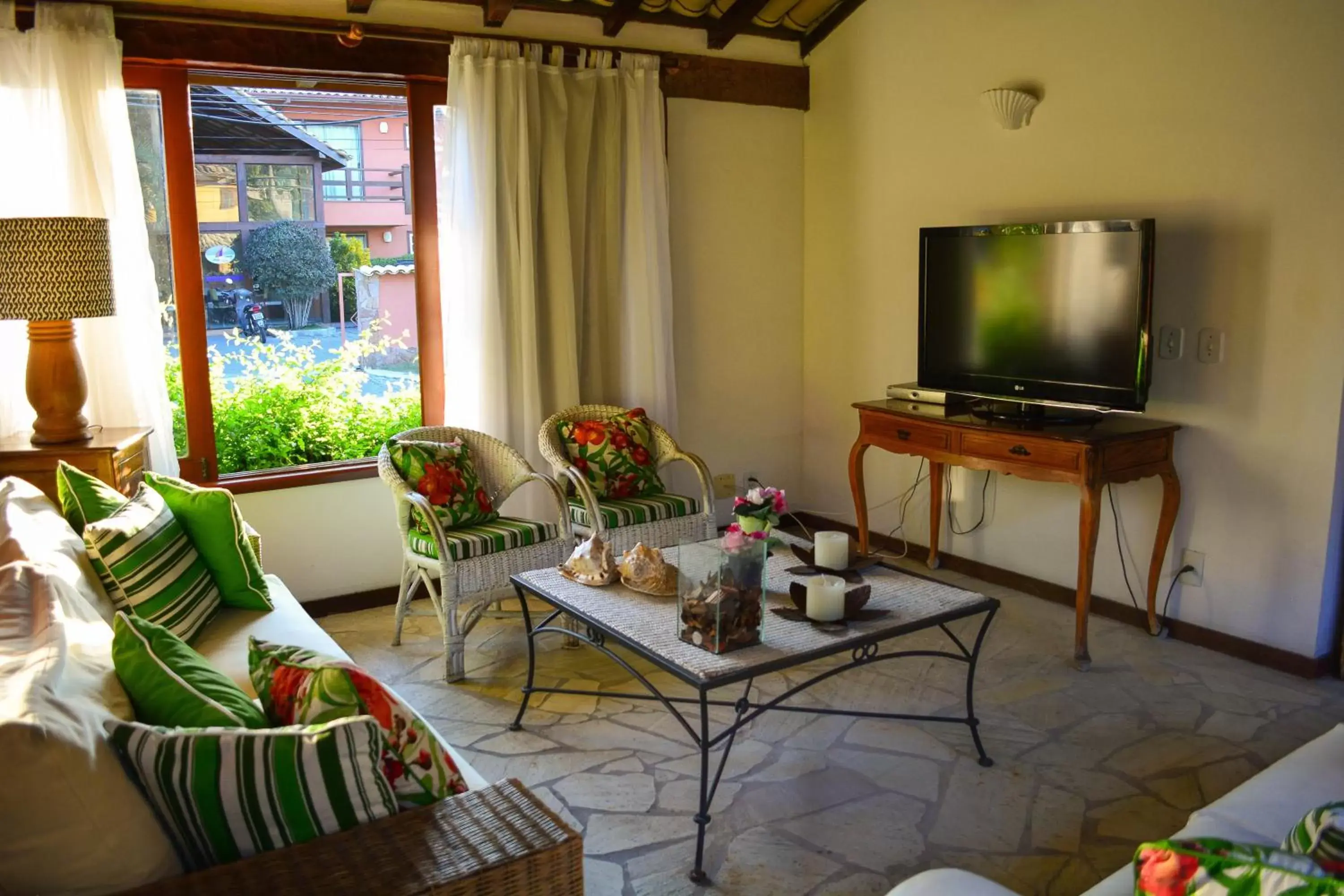 Communal lounge/ TV room, Seating Area in Pousada do Namorado