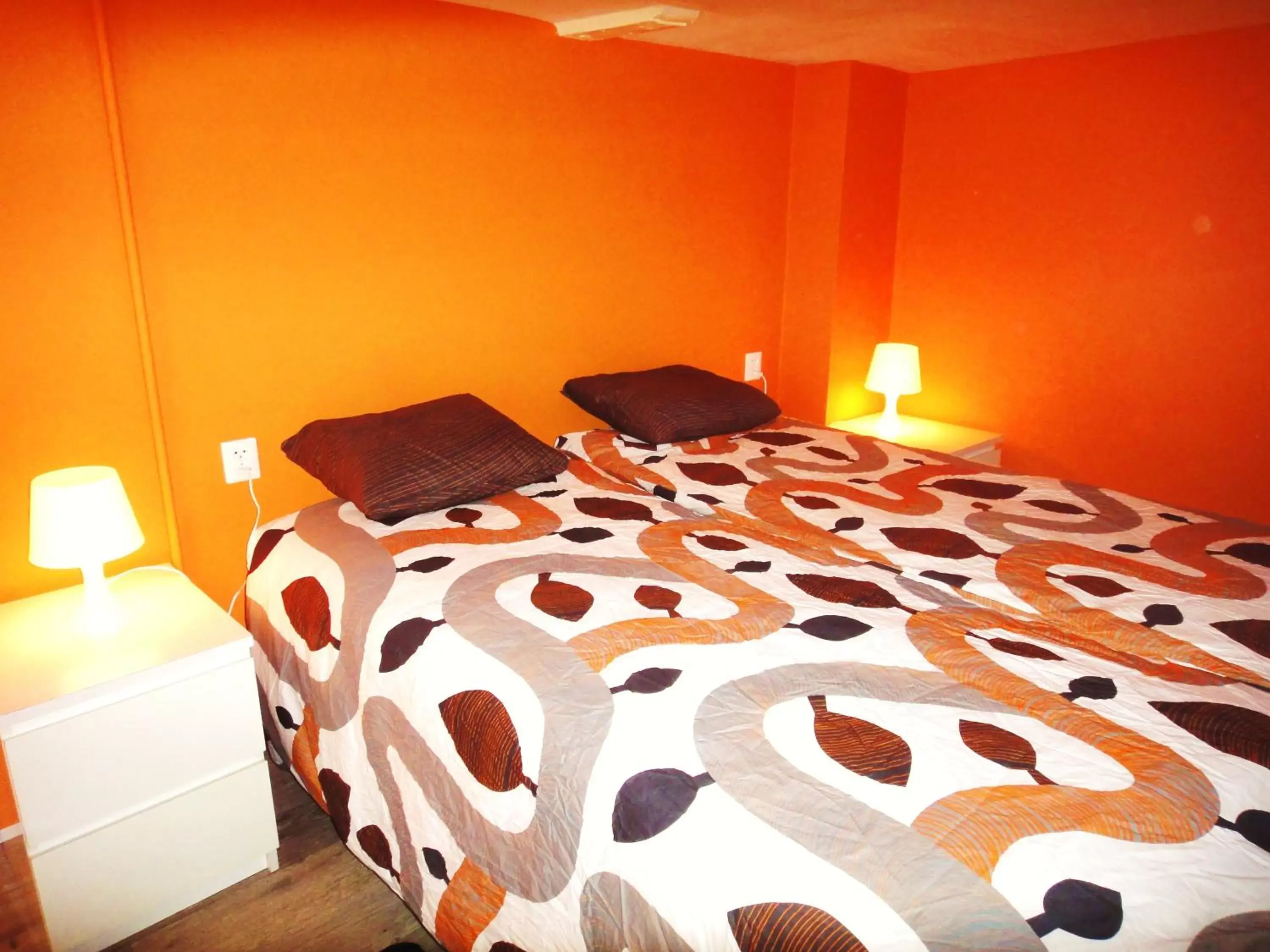 Bed in Orange Suite Studio