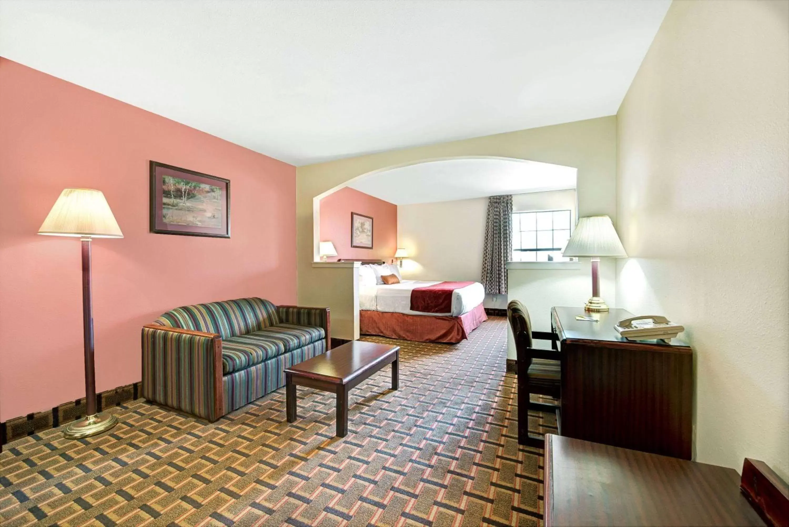 Bed, Seating Area in Days Inn by Wyndham Dallas Plano