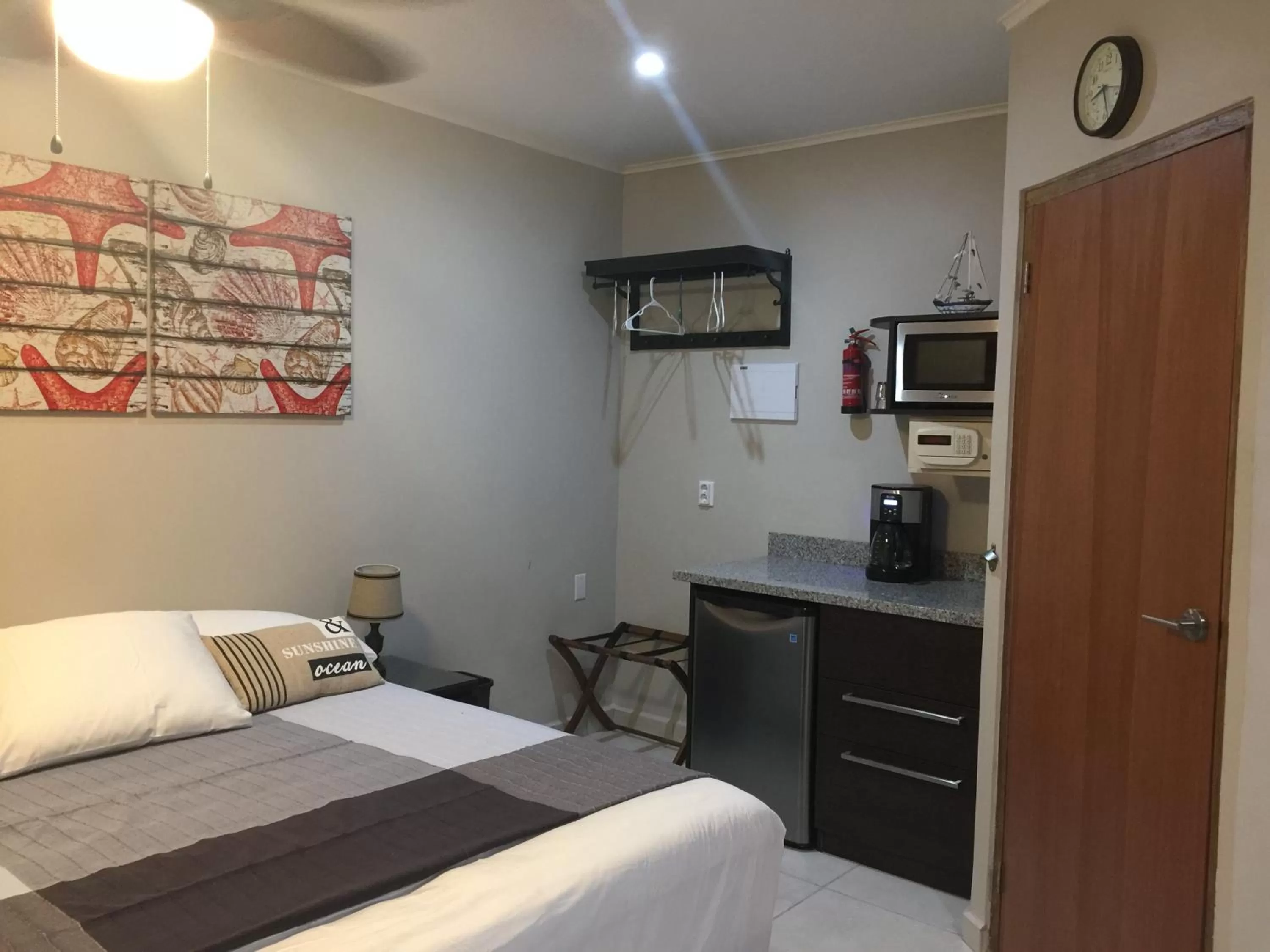 Bed in The Pier Beach Inn & Suites