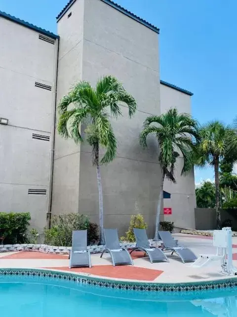 Property building, Swimming Pool in The Palms Inn & Suites Miami, Kendall, FL