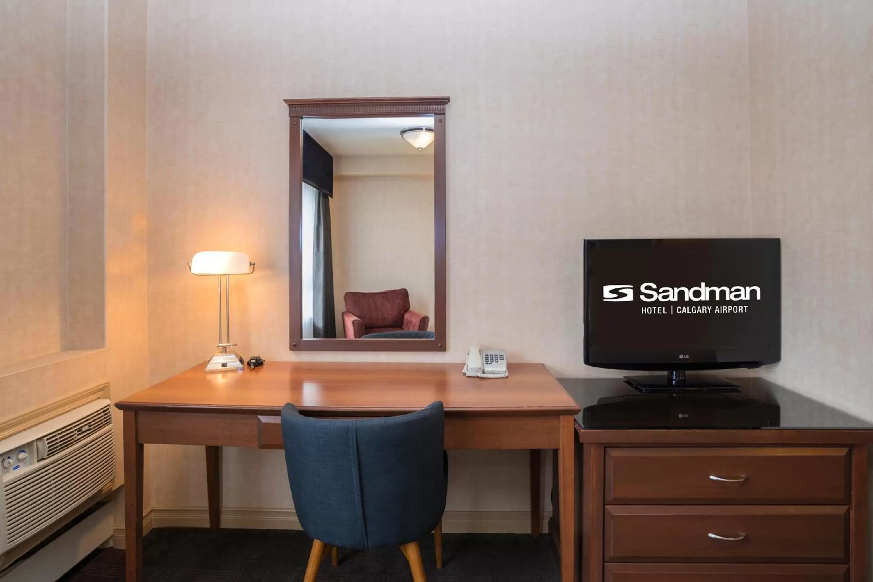 Photo of the whole room, TV/Entertainment Center in Sandman Hotel Calgary Airport