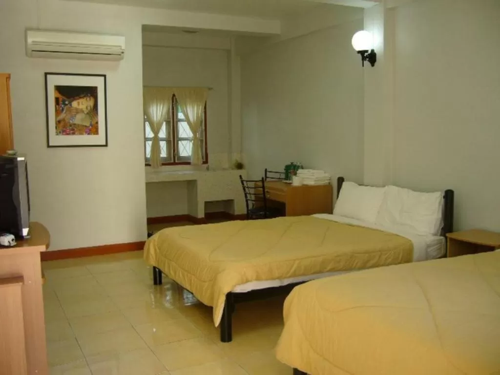 Bed in Pikul Apartment Hotel