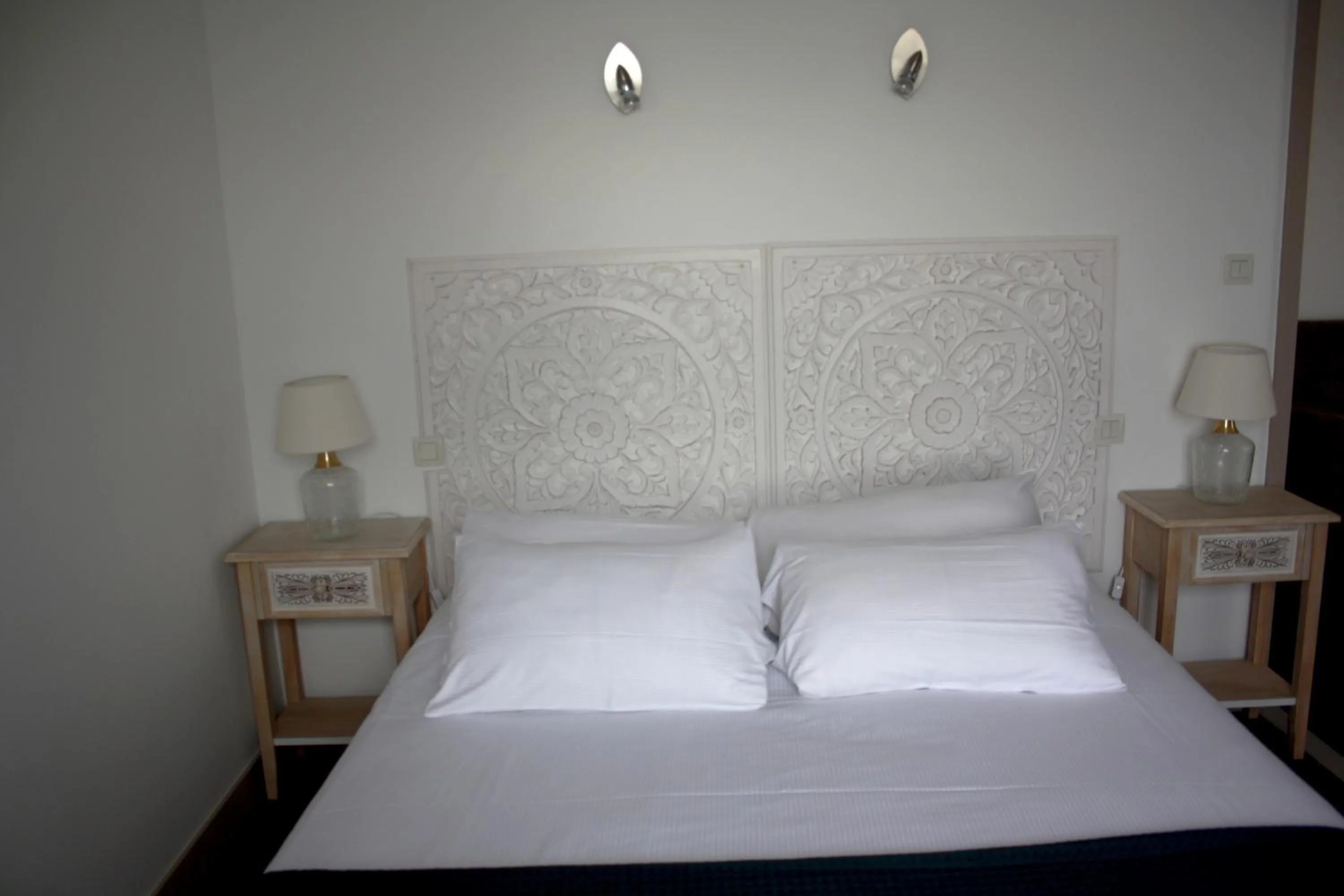 Bed in Logis Hôtel Sea View