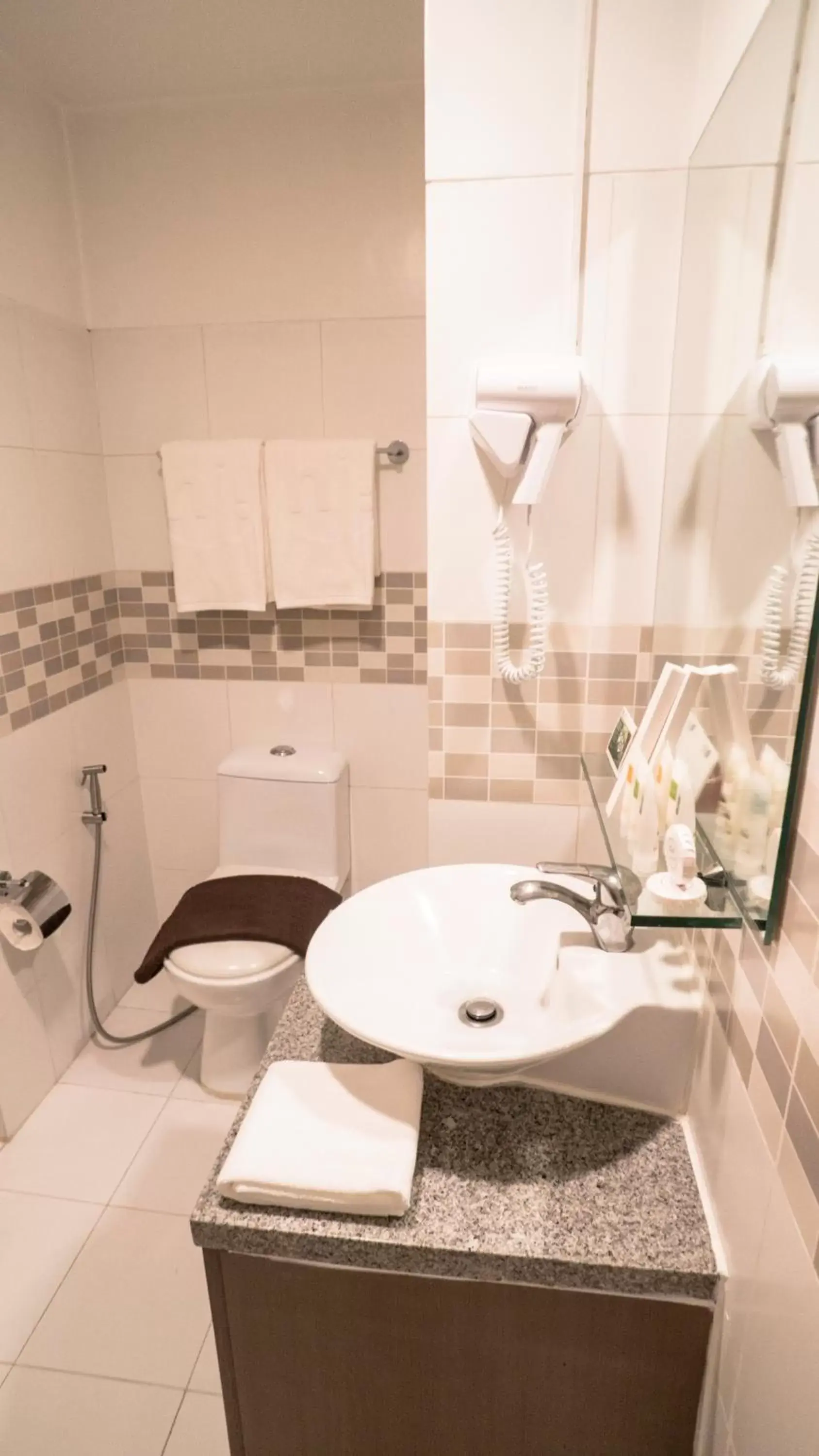 Bathroom in The Exchange Regency Residence Hotel Managed by HII