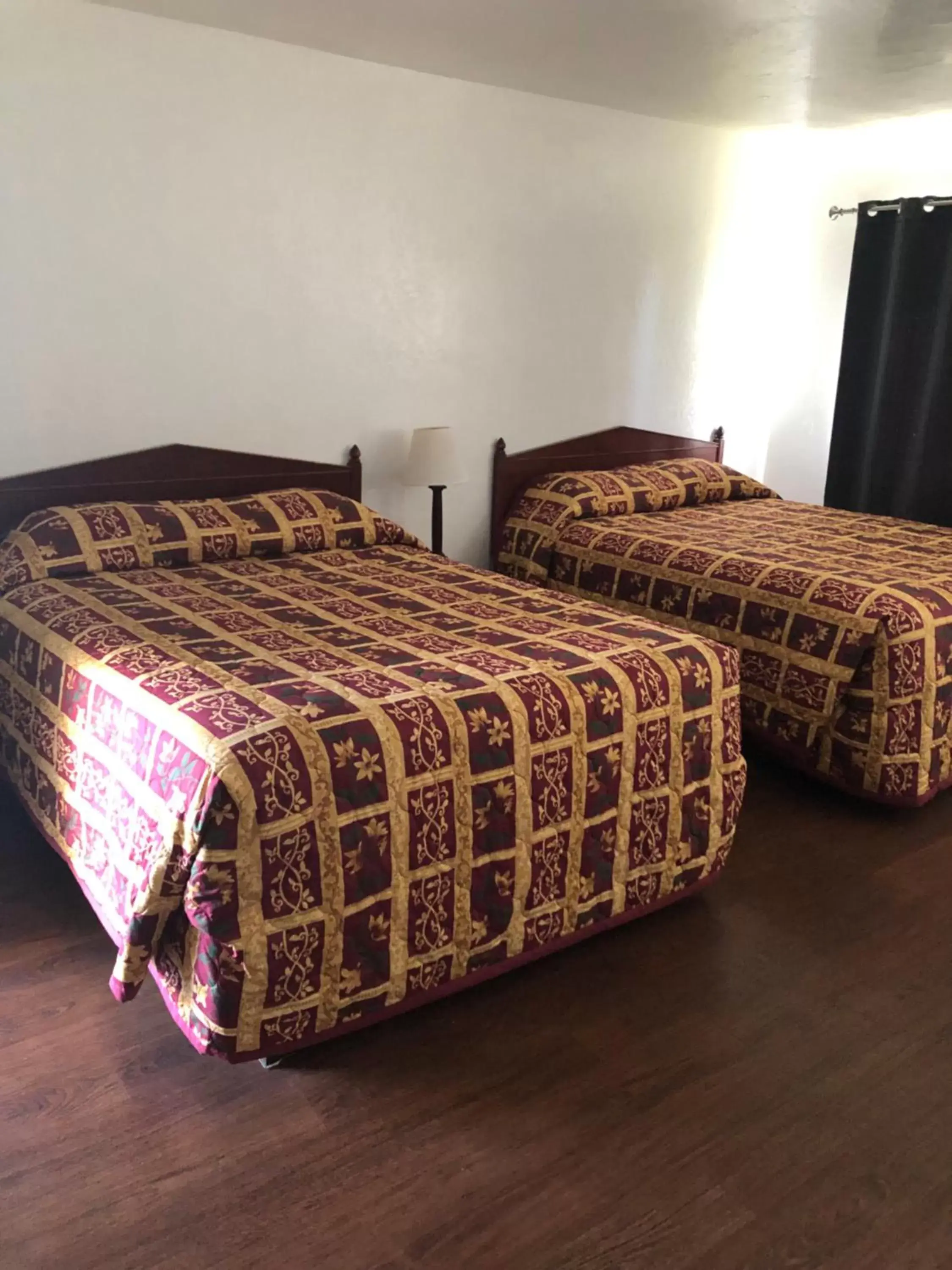 Bed in Pine Cone Motel