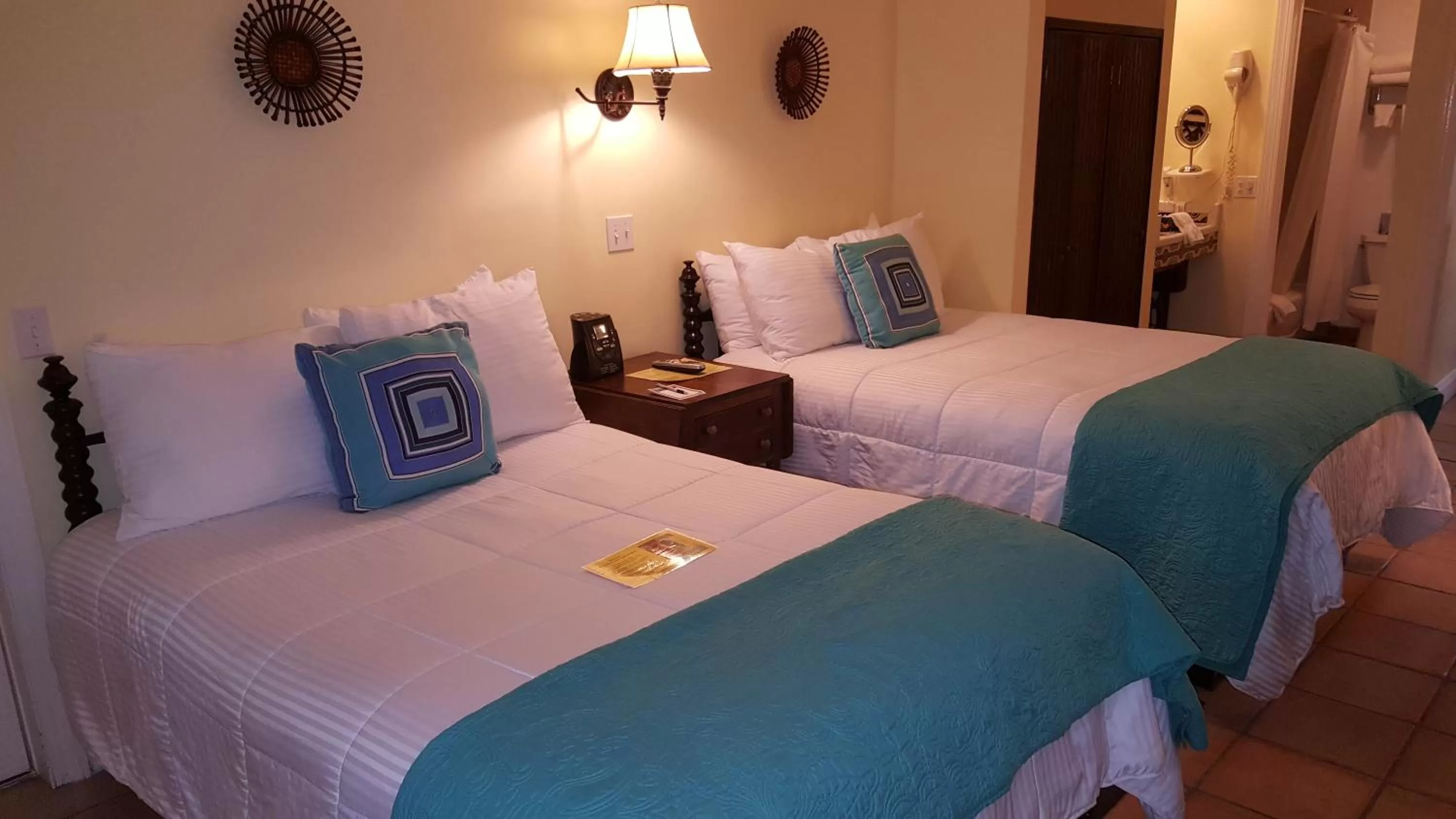 Bedroom, Bed in The Caribbean Court Boutique Hotel