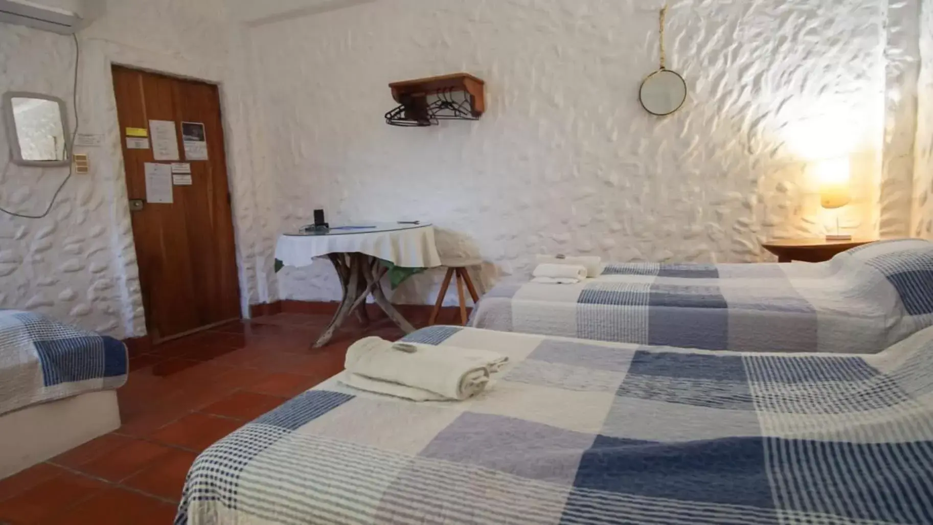 Single Bed in Female Dormitory Room in Hostal Galapagos by Bar de Beto Single Bed in Female Dormitory Room in Hostal Galapagos by Bar de Beto
