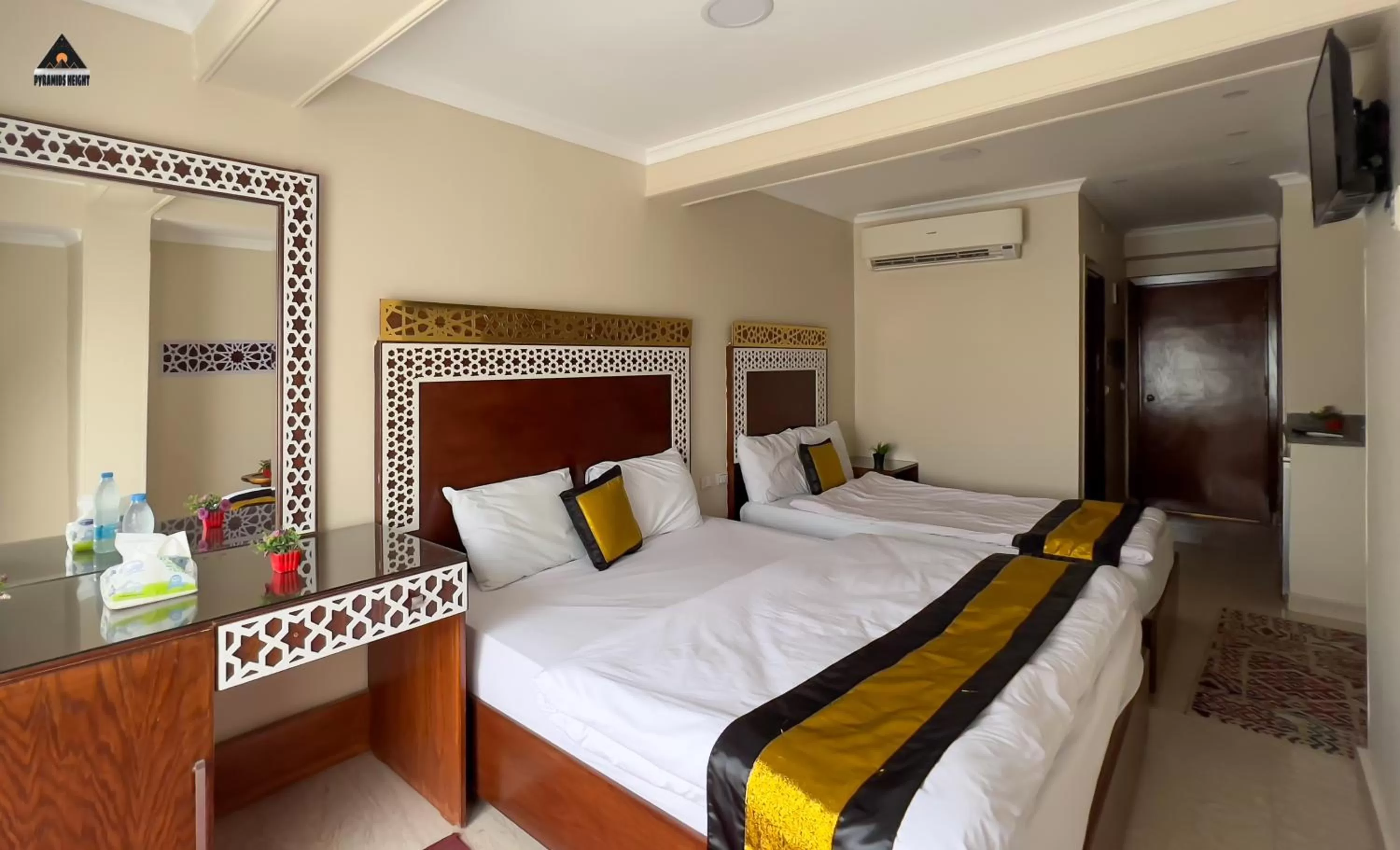 Bed in Pyramids Height Hotel & Pyramids Master Scene Rooftop